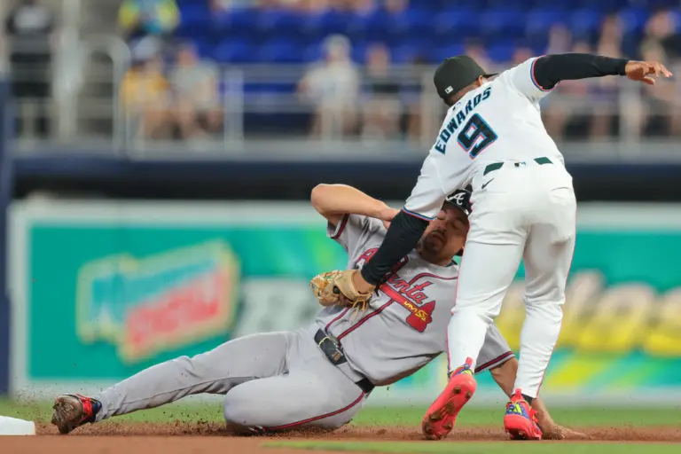 Miami Marlins second baseman Xavier Edwards tags out Atlanta Braves catcher Drake Baldwin during the first inning at loanDepot Park in Miami, Florida, on May 18, 2026.
