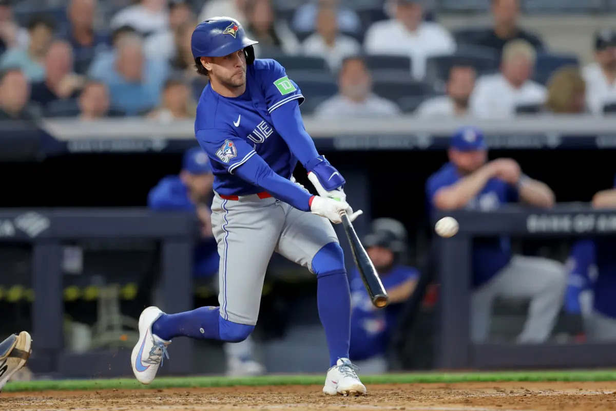 Toronto Blue Jays shortstop Ernie Clement hitting a three-run home run vs the New York Yankees during the fourth inning at Yankee Stadium in Bronx, New York on May 18, 2026.