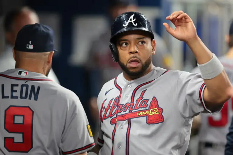 Braves designated hitter Dominic Smith (8) celebrates after scoring a run in May 2026.