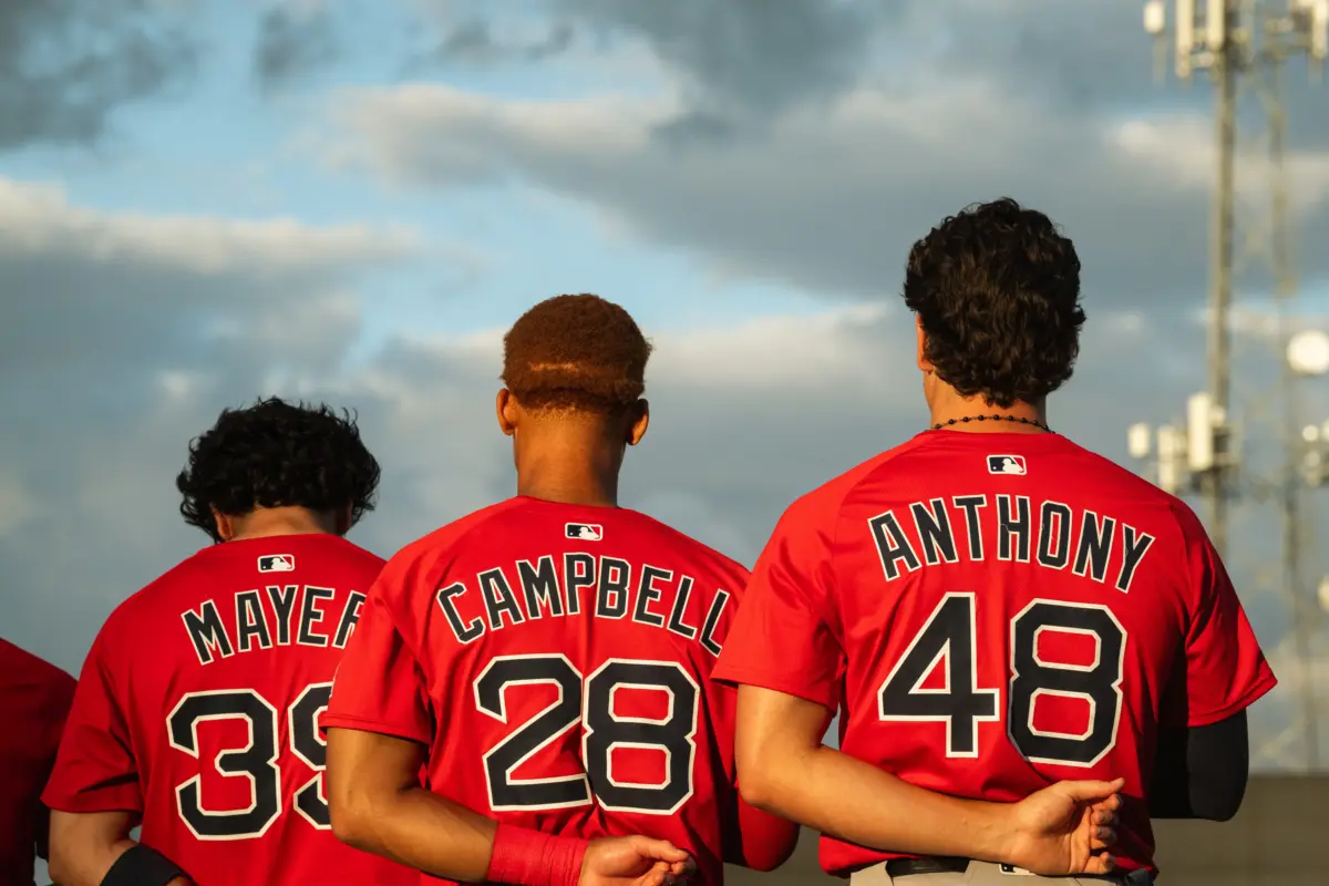 Boston's top-three prospects in Marcelo Mayer, Kristian Campbell and Roman Anthony stand for the national anthem ahead of a Spring Training breakout game on March 13, 2025.