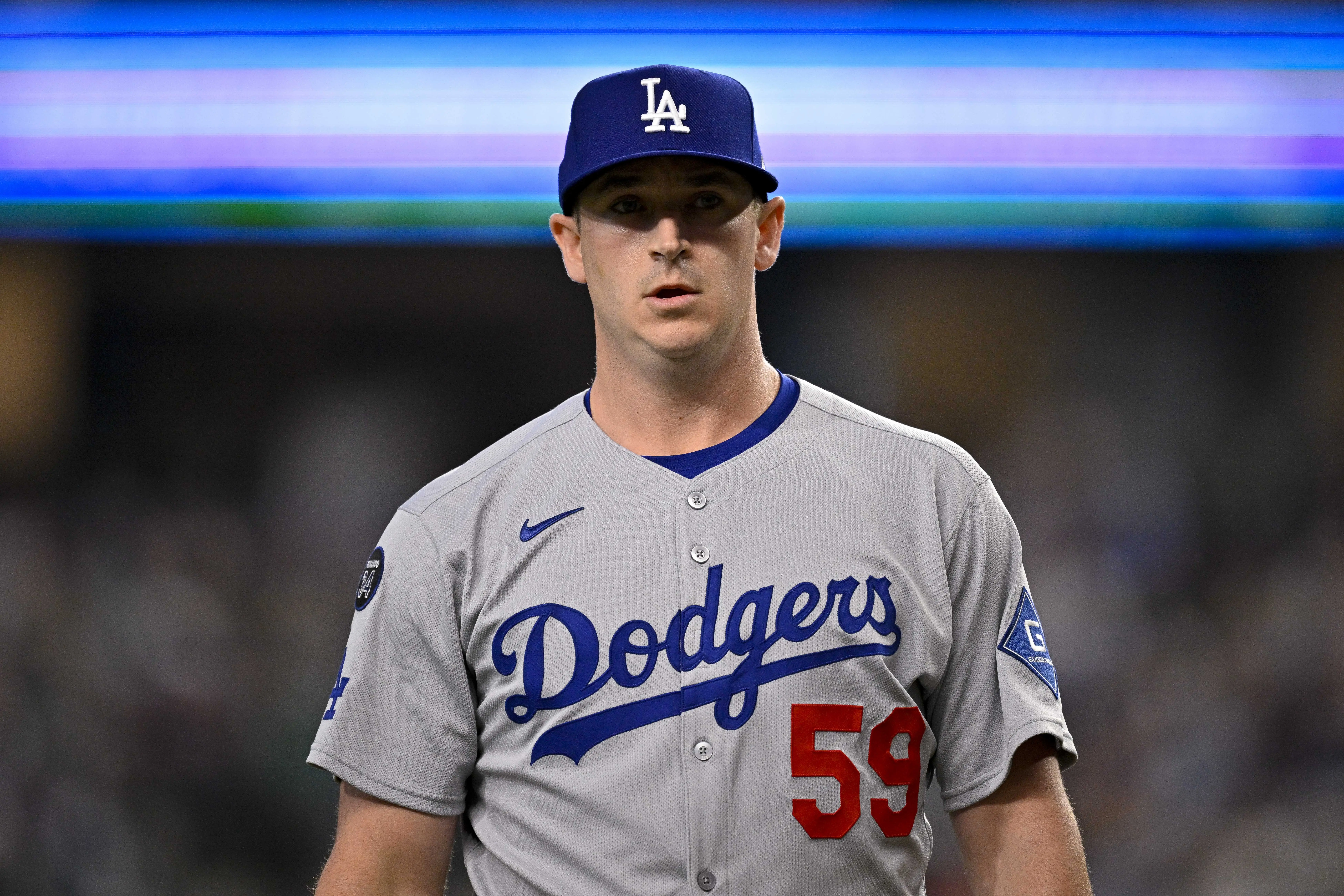 Los Angeles Dodgers reliever Evan Phillips comes off the field during the game between the Texas Rangers and the Los Angeles Dodgers at Globe Life Field in Arlington, Texas on April 20, 2025.