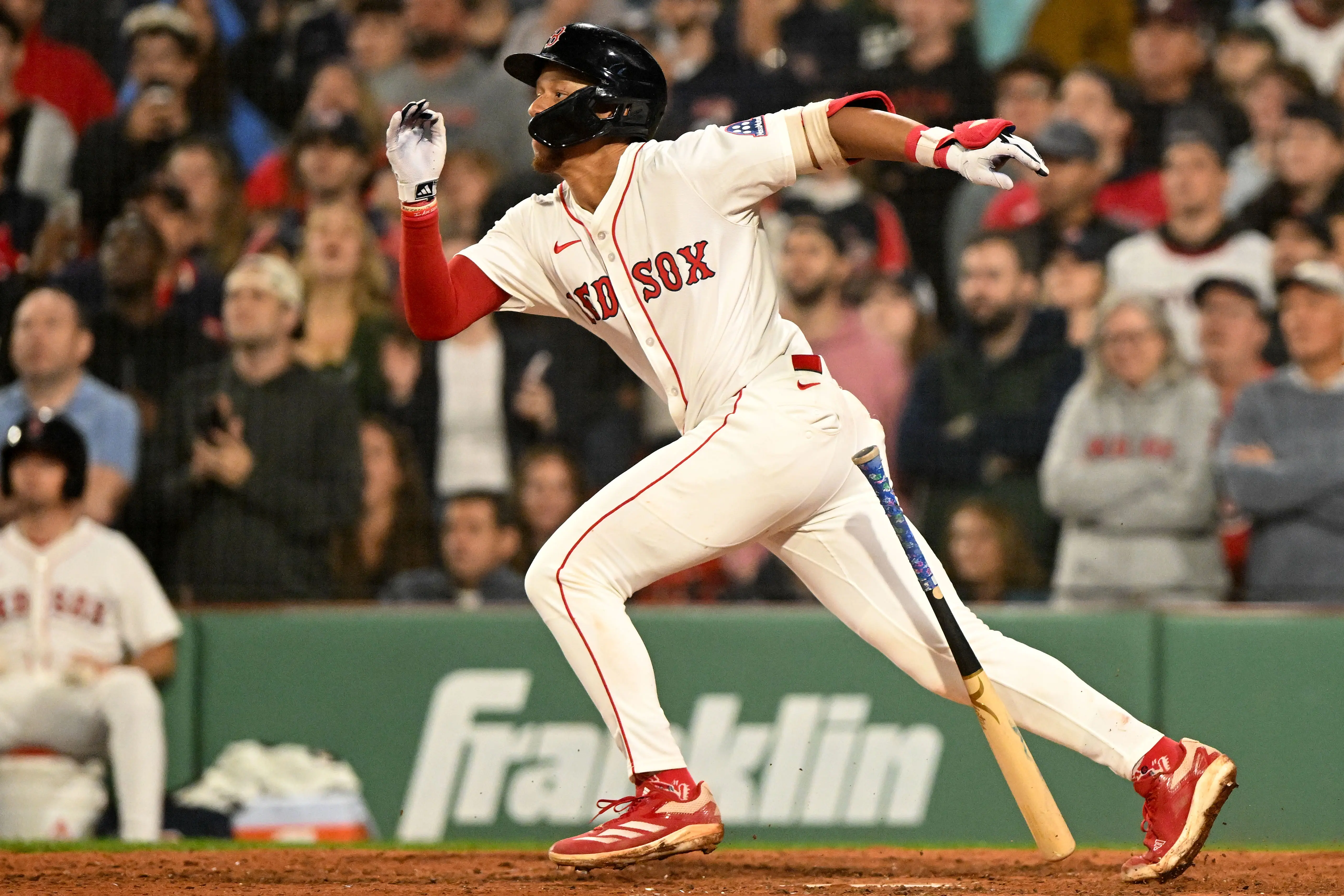 Red Sox second baseman Kristian Campbell (28) hits a RBI against the Tampa Bay Rays during the ninth inning at Fenway Park. 