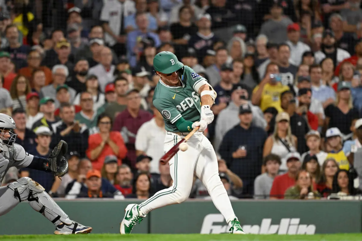 Red Sox second baseman Romy Gonzalez (23) gets a base hit in the ninth inning against the Detroit Tigers at Fenway Park.