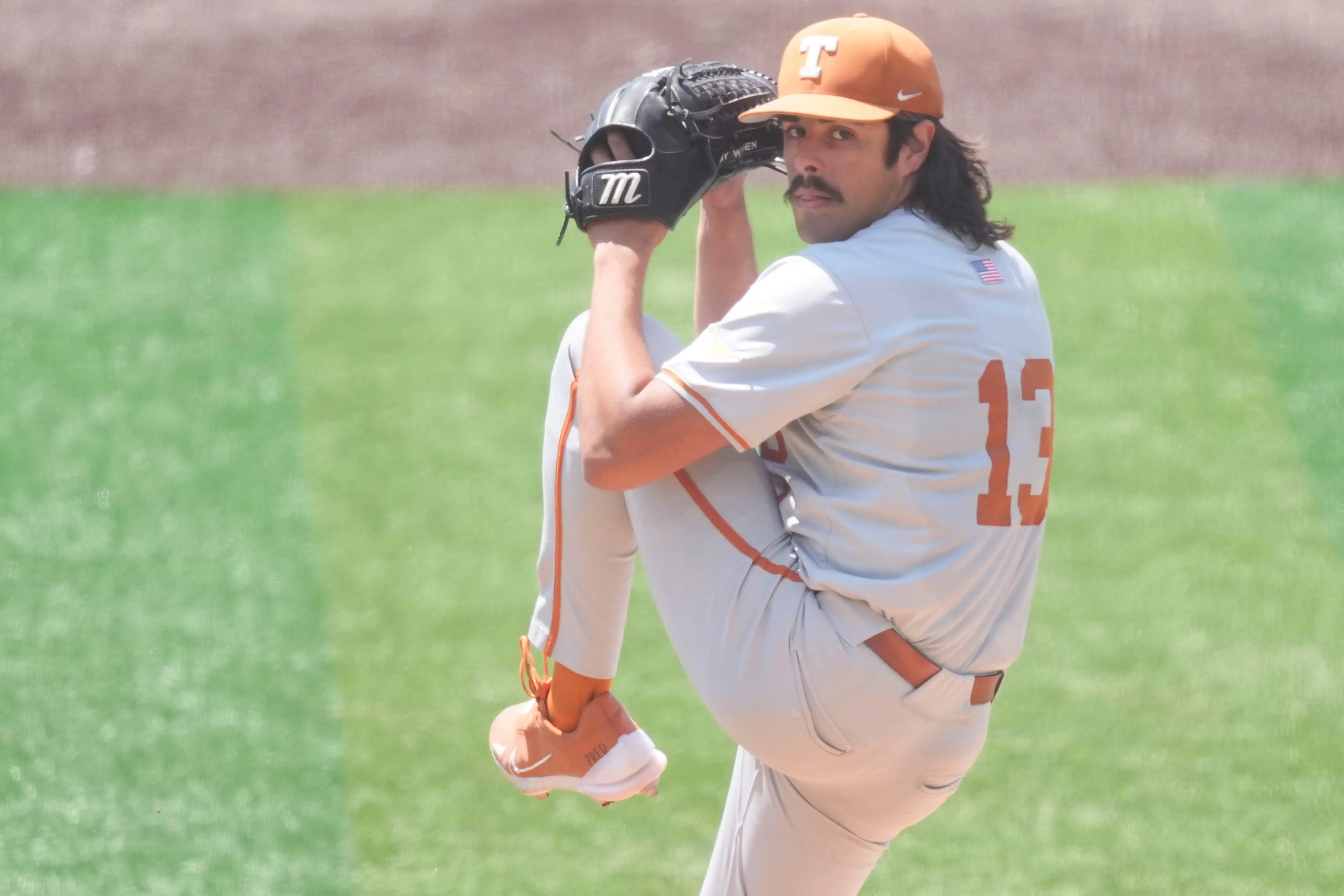 Texas' Ruger Riojas (13) opens against Tennessee in an NCAA college baseball game in Knoxville, Tennessee.