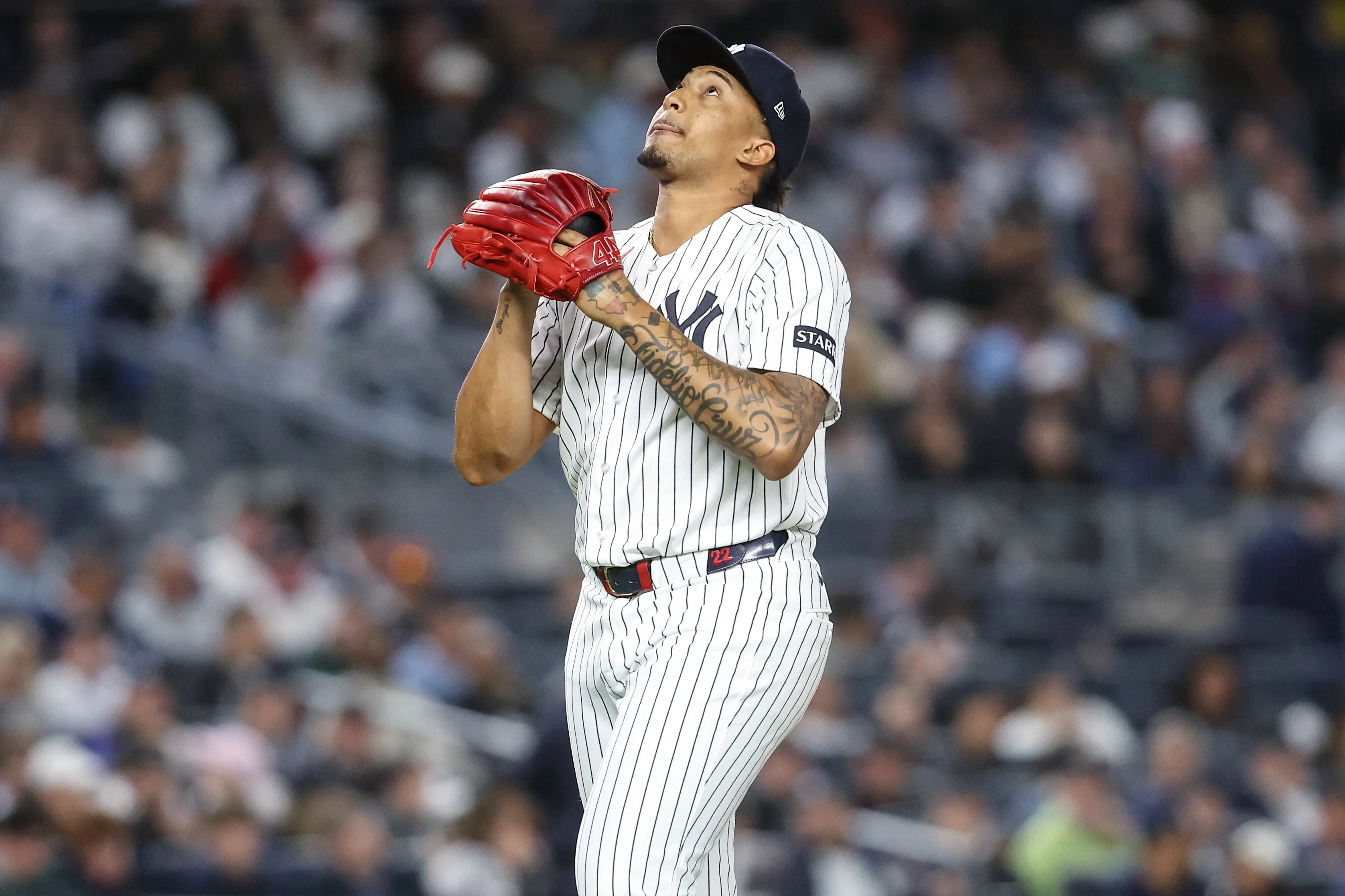 ankees relief pitcher Yovanny Cruz (96) reacts after getting taken out of the game in the sixth inning against the Toronto Blue Jays at Yankee Stadium.
