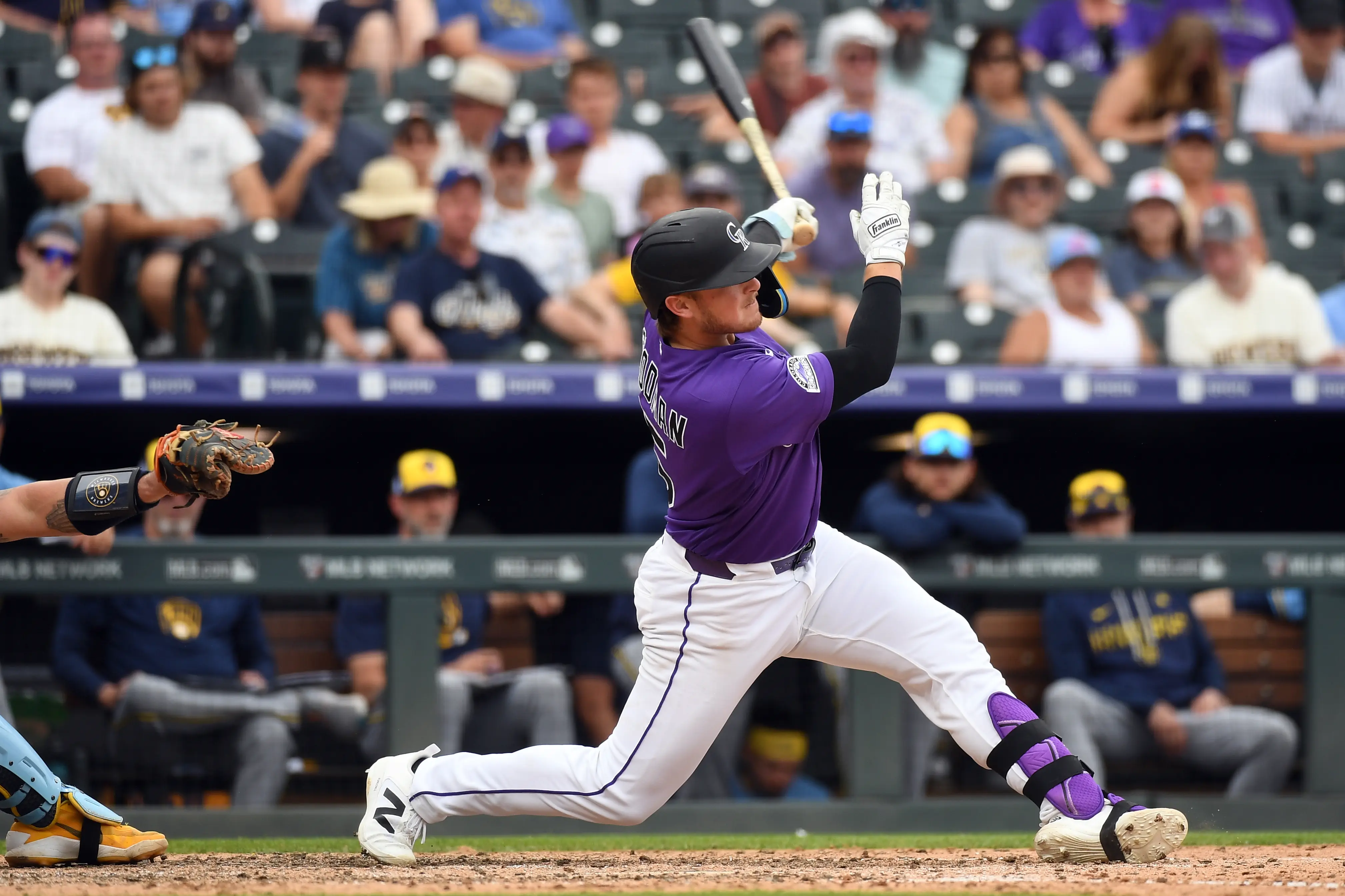 Colorado Rockies catcher Hunter Goodman hits a home run in the ninth inning vs the Milwaukee Brewers at Coors Field in Denver, Colorado on June 7, 2026.