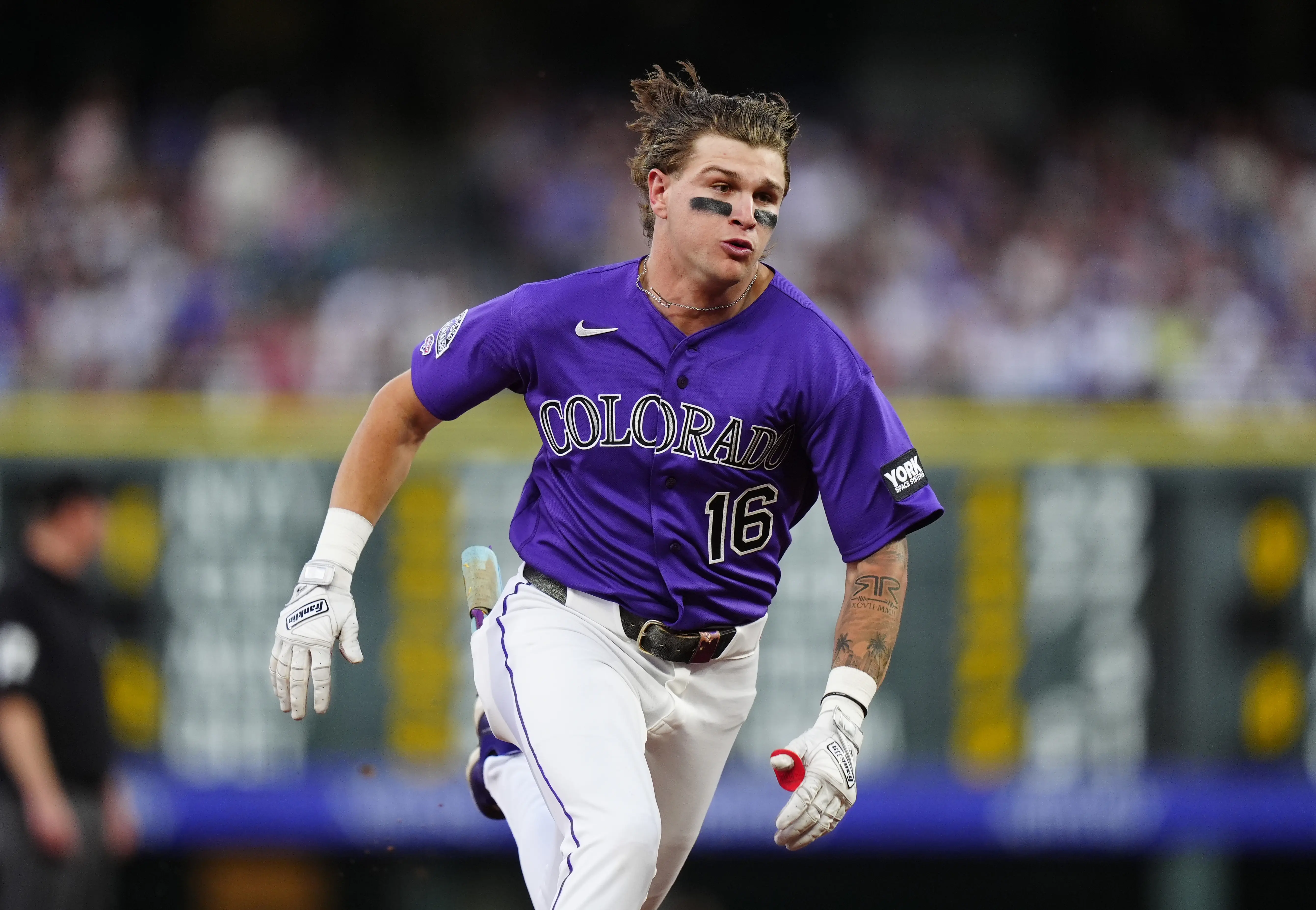 Colorado Rockies center fielder Cole Carrigg running to third after hitting a triple vs the Chicago Cubs in the fourth inning to earn his first career Major-League hit at Coors Field in Denver, Colorado on June 9, 2026.