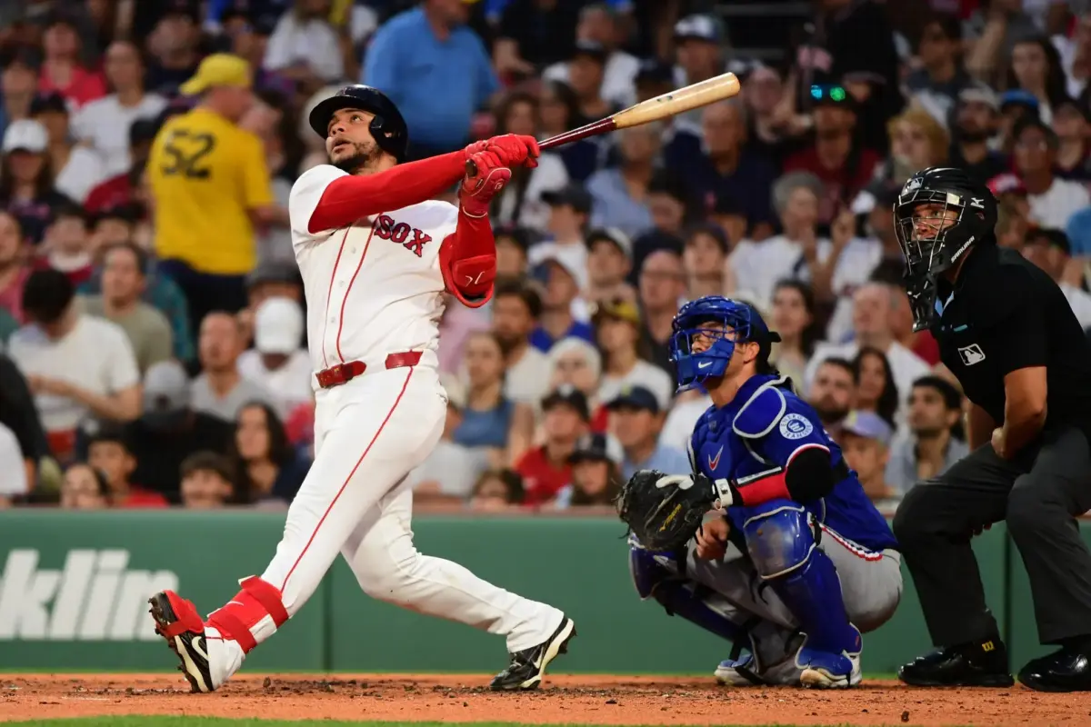 Red Sox first baseman Willson Contreras (40) hits a home run against the Texas Rangers at Fenway Park.