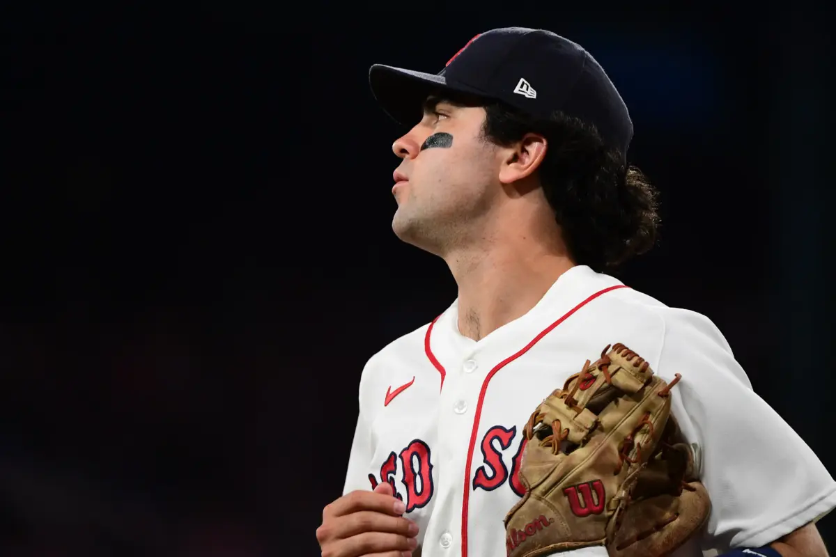 Boston Red Sox shortstop Marcelo Mayer looking on after a wild throw during the fourth inning against the Texas Rangers at Fenway Park in Boston, Massachusetts on June 14, 2026.