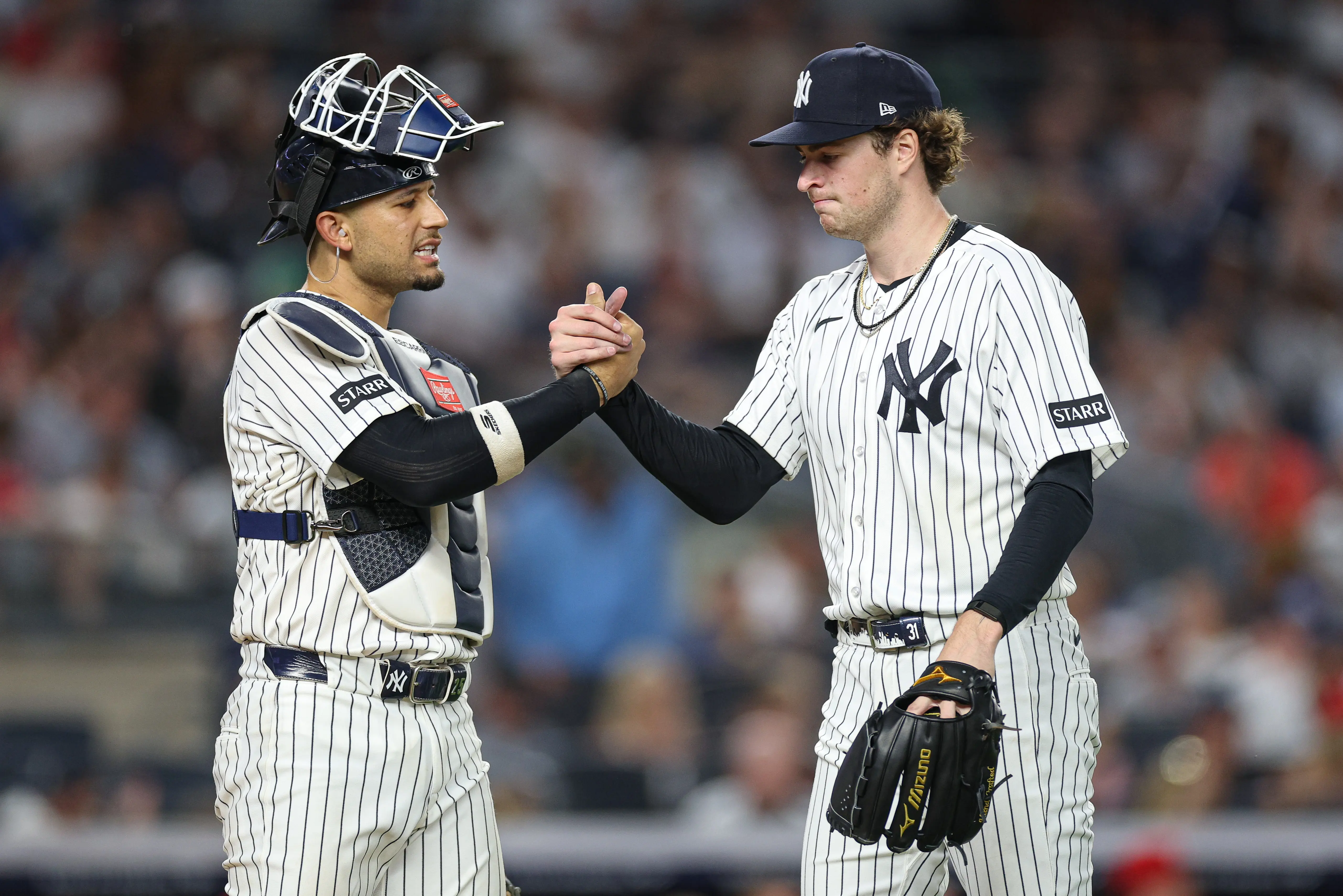 New York Yankees starting pitcher Cam Schlittler daps up catcher JC Escarra after the top of the sixth inning vs the Cincinnati Reds at Yankee Stadium in Bronx, New York on June 19, 2026.