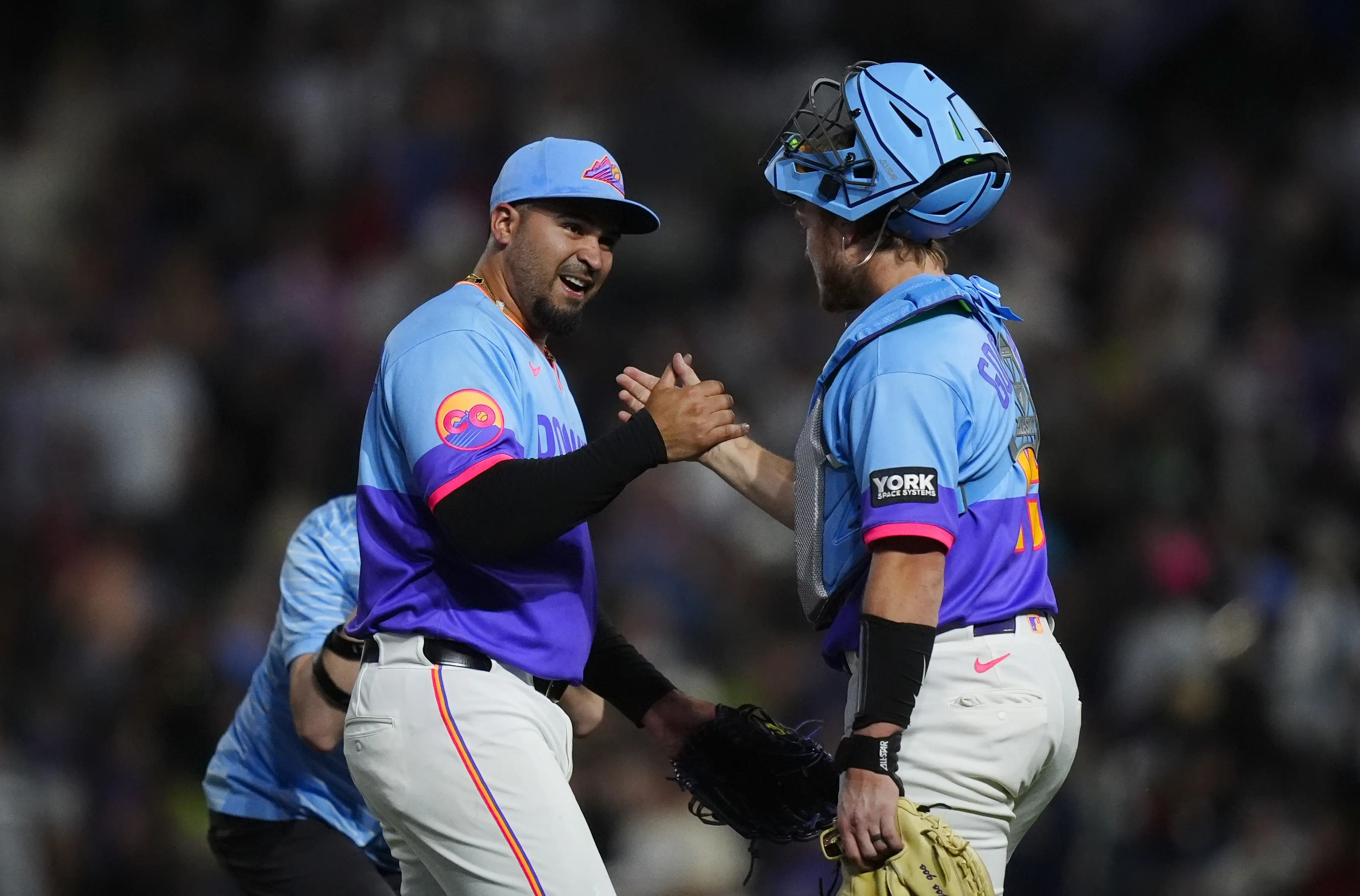 Colorado Rockies pitcher Antonio Senzatela celebrating with catcher Hunter Goodman after the Rockies clinched a victory vs the Pittsburgh Pirates at Coors Field in Denver, Colorado, on June 19, 2026.