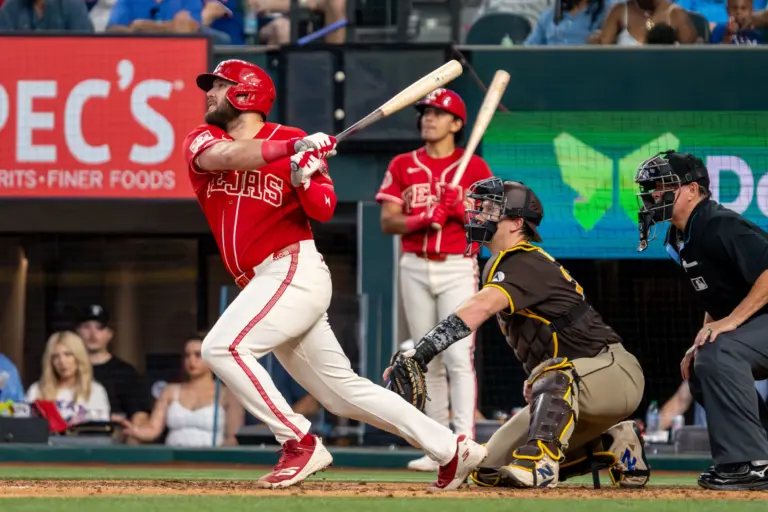 Texas Rangers first baseman Jake Burger hitting a two-run home run vs the San Diego Padres during the seventh inning at Globe Life Field in Arlington, Texas on June 20, 2026.