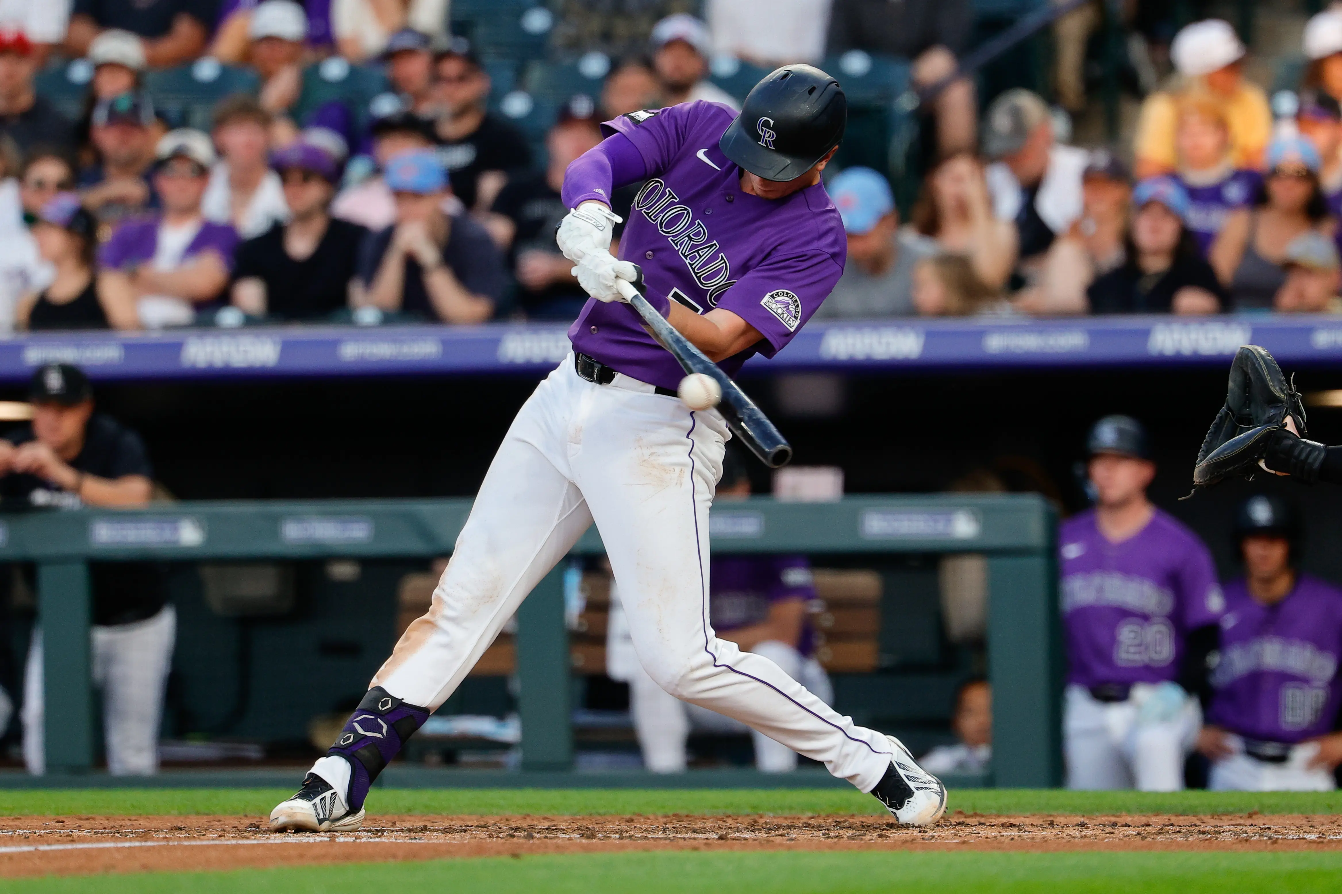 Colorado Rockies first baseman TJ Rumfield hitting an RBI single in the third inning vs the Pittsburgh Pirates at Coors Field in Denver, Colorado on June 20, 2026.