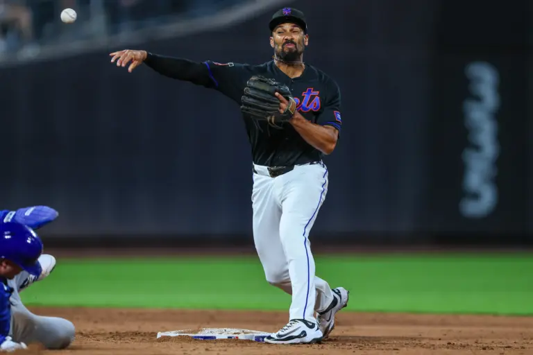 Mets second baseman Marcus Semien (10) turns a double play during the sixth inning against the Chicago Cubs at Citi Field.