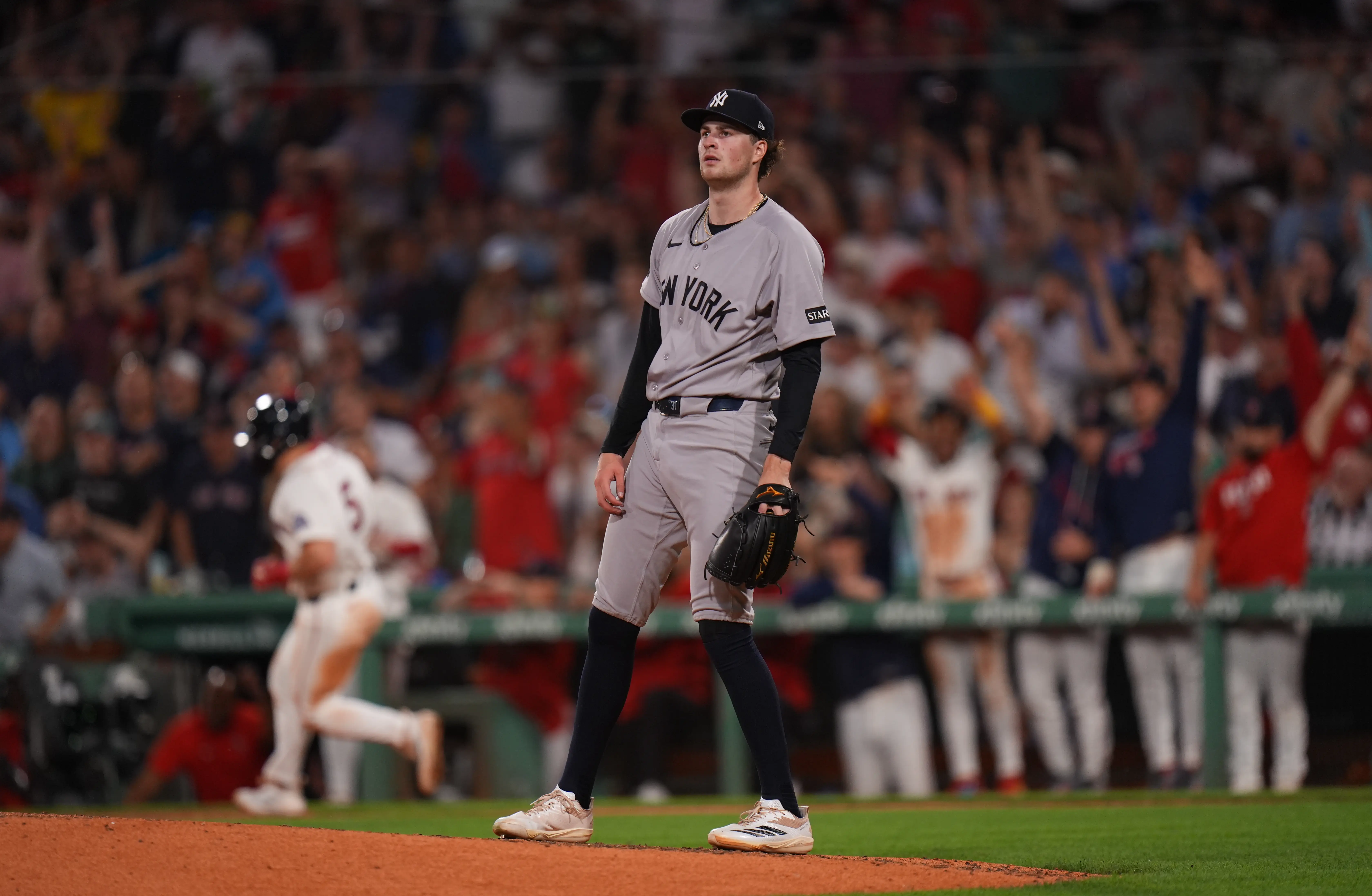 New York Yankees starting pitcher Cam Schlittler looking on after allowing a two-run home run to Boston Red Sox third baseman Caleb Durbin during the fifth inning at Fenway Park in Boston, Massachusetts on June 25, 2026.