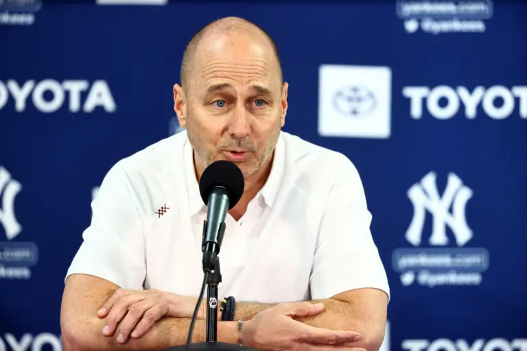 Yankees general manager Brian Cashman talks with media during spring training workouts at George M. Steinbrenner Field.