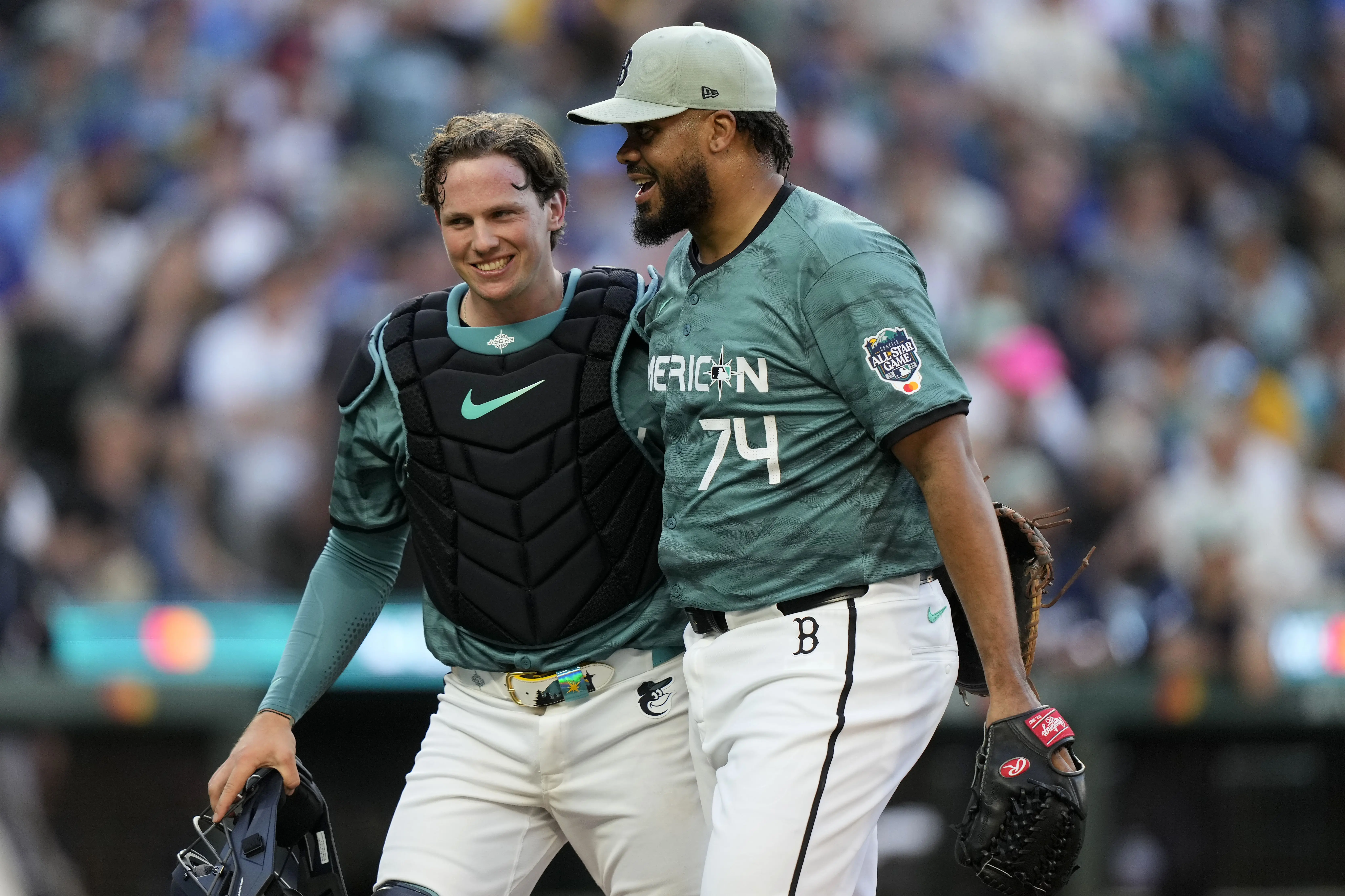 American League All Star pitcher Kenley Jansen of the Boston Red Sox and catcher Adley Rutschman of the Baltimore Orioles walking towards the mound together during the eighth inning at T-Mobile Park in Seattle, Washington on July 11, 2023.