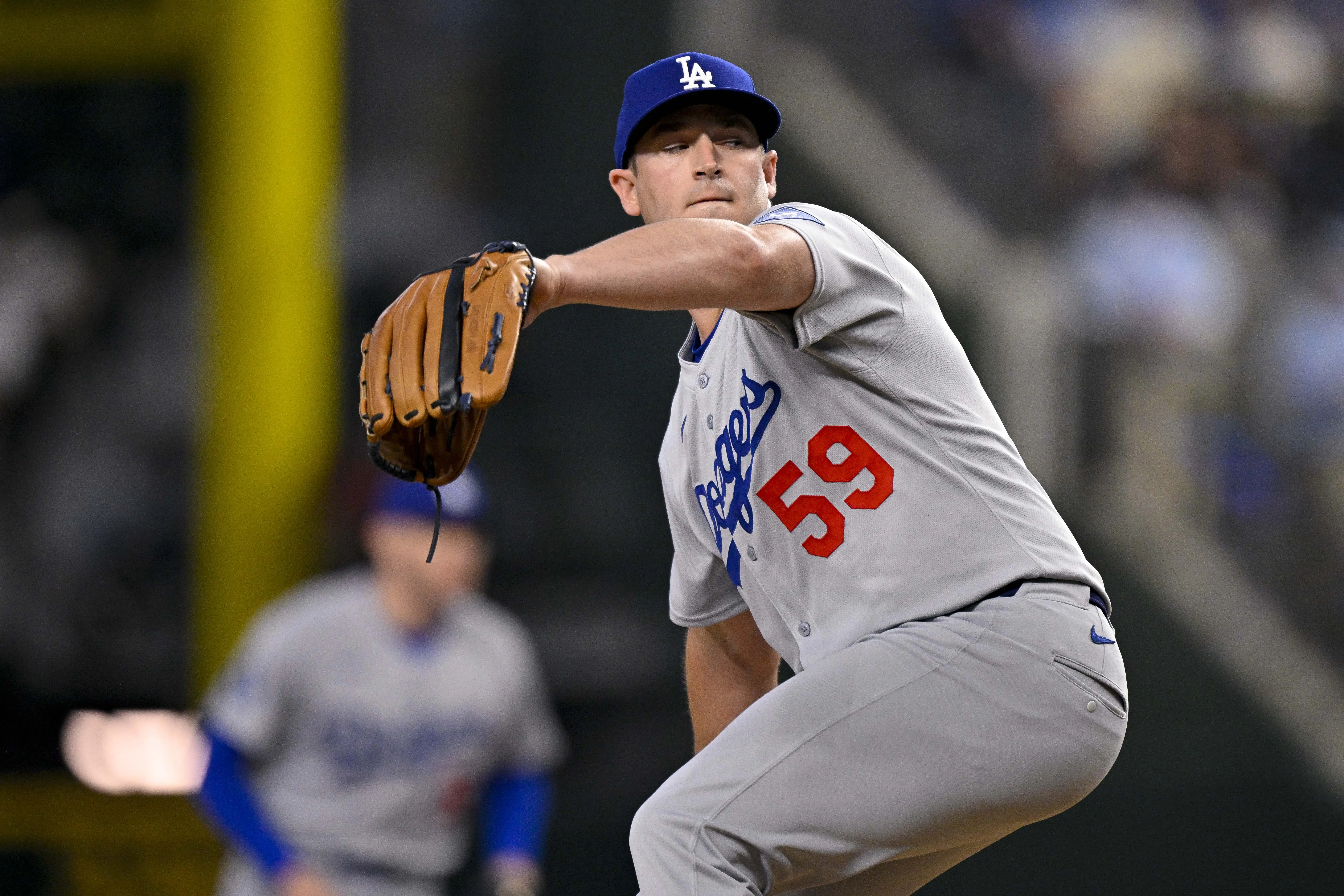 Los Angeles Dodgers reliever Evan Phillips pitching during the game between the Texas Rangers and the Los Angeles Dodgers at Globe Life Field in Arlington, Texas on April 20, 2025.