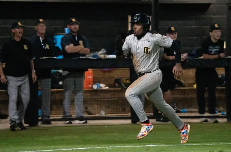 Oak Grove player Eric 'EJ' Booth Jr. (3) runs to home and scores a run during the game against Northwest Rankin in Flowood, Miss., on Tuesday, March 24, 2026.
