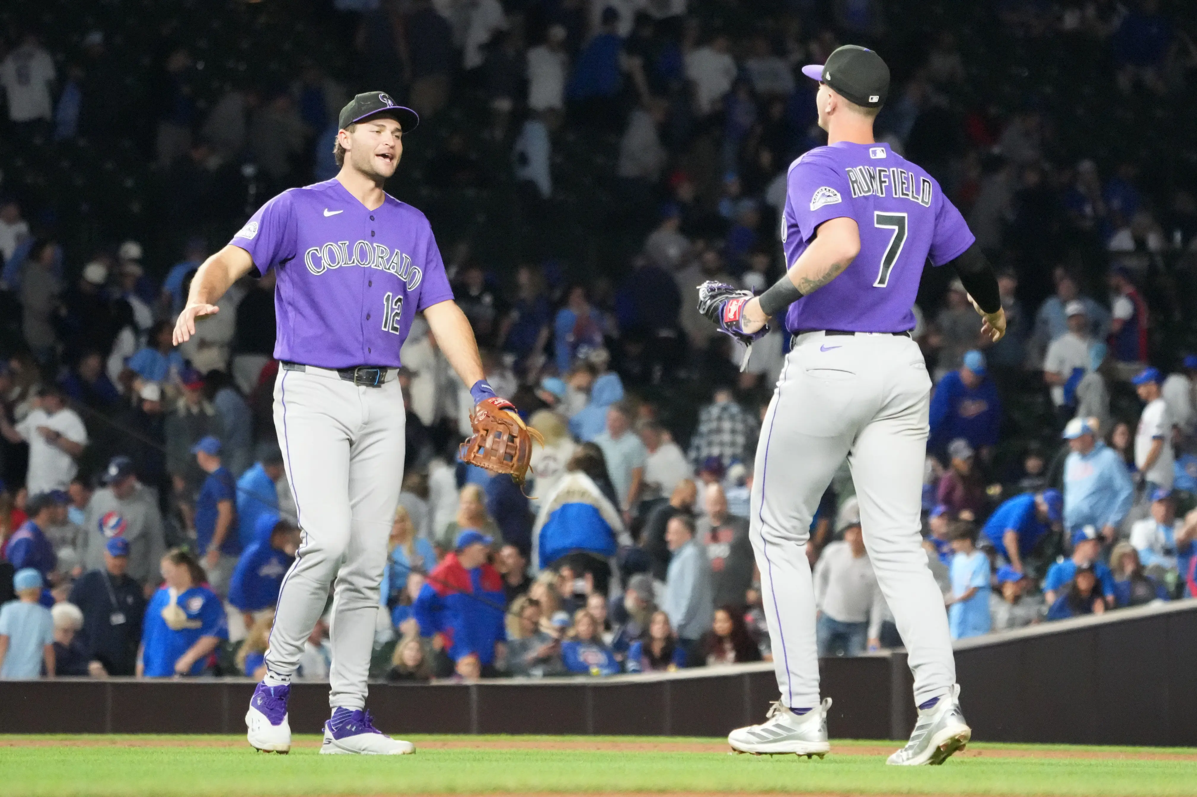 Colorado Rockies first baseman TJ Rumfield and third baseman Kyle Karros celebrating a road win over the Chicago Cubs at Wrigley Field in Chicago, Illinois on June 16, 2026.