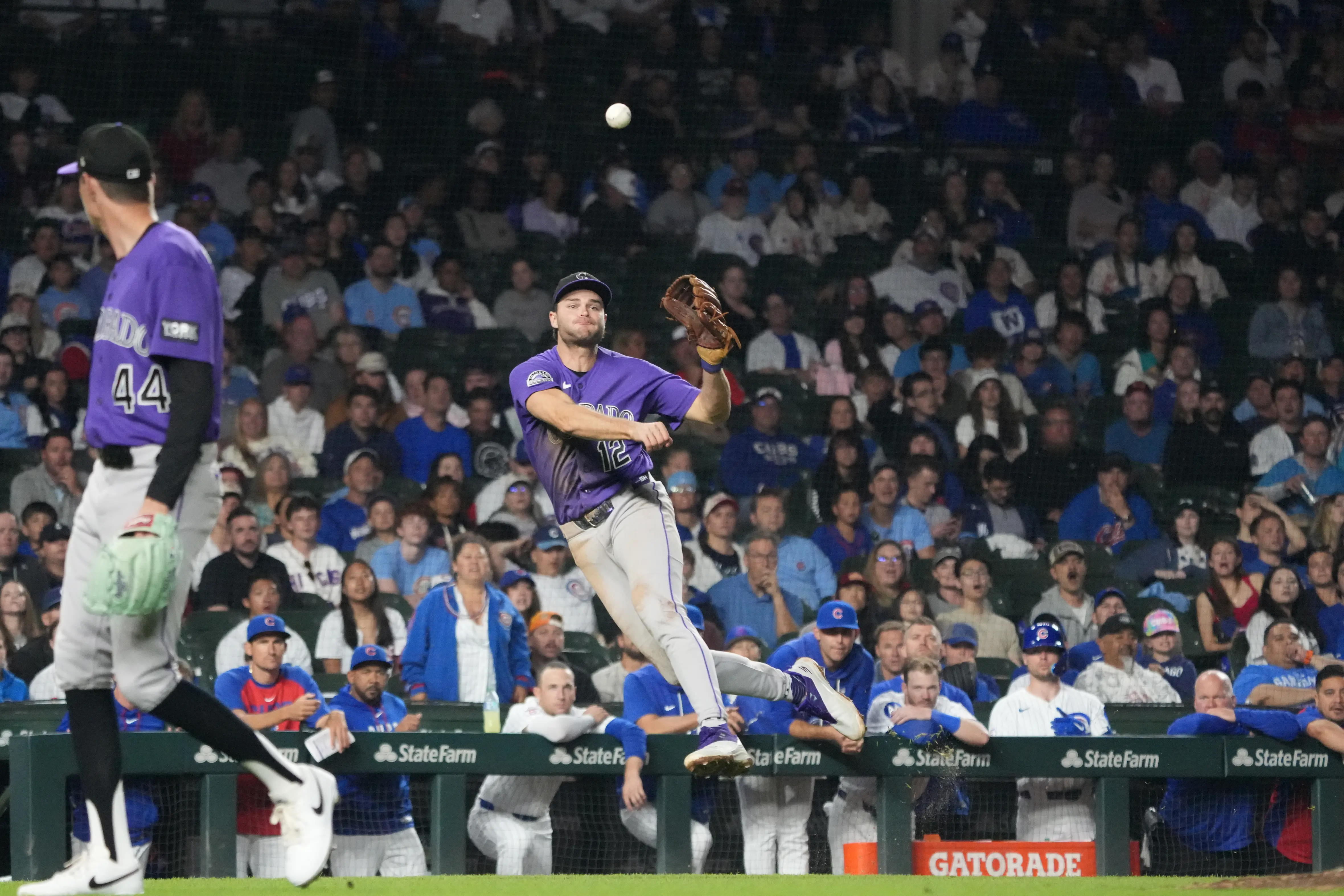 Colorado Rockies third baseman Kyle Karros attempting to make a play on an infield single by Chicago Cubs right fielder Matt Shaw at Wrigley Field in Chicago, Illinois on June 17, 2026.