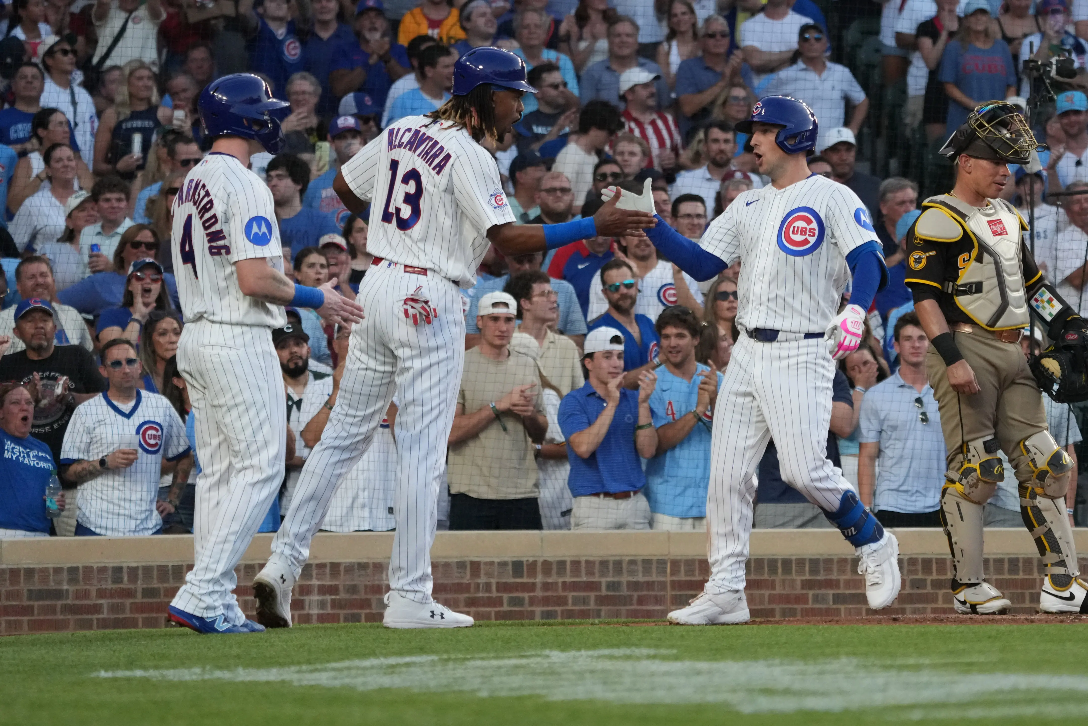 Chicago Cubs third baseman Alex Bregman celebrates his three-run home run with right fielder Kevin Alcántara against the San Diego Padres during the second inning at Wrigley Field in Chicago, Illinois, on June 30, 2026.