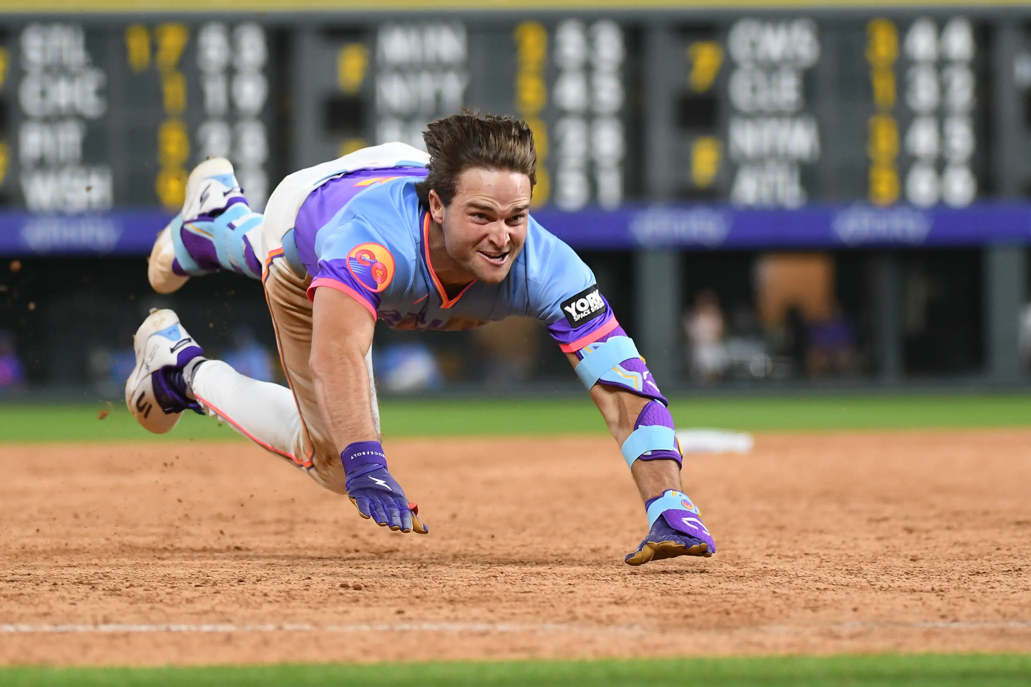 Colorado Rockies third baseman Kyle Karros sliding into third after hitting a triple in the eighth inning vs the San Francisco Giants at Coors Field in Denver, Colorado on July 3, 2026.