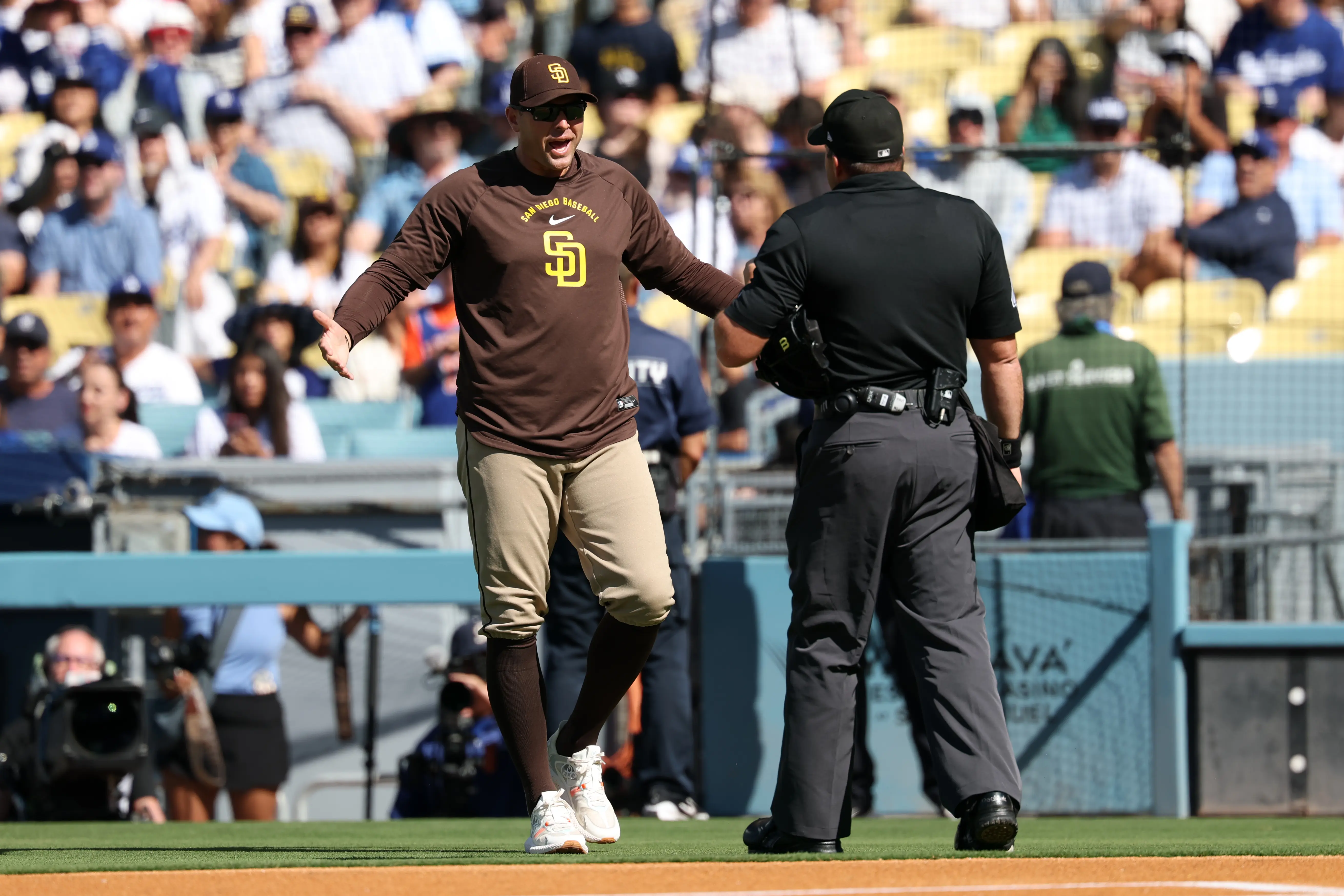 San Diego coaching staff manager Craig Stammen arguing with home plate umpire