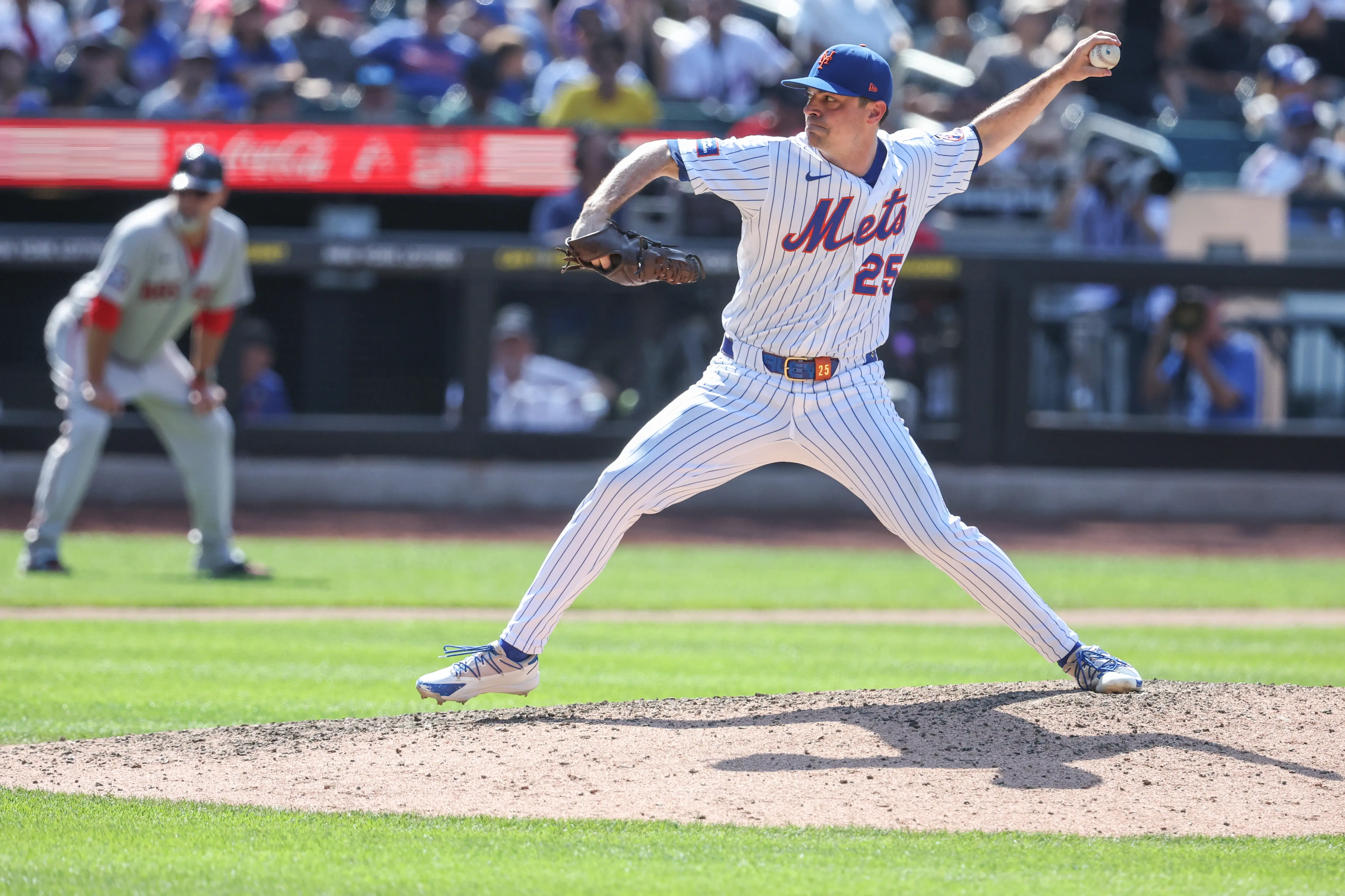 Mets relief pitcher Brooks Raley (25) pitches in the tenth inning against the Boston Red Sox at Citi Field. 