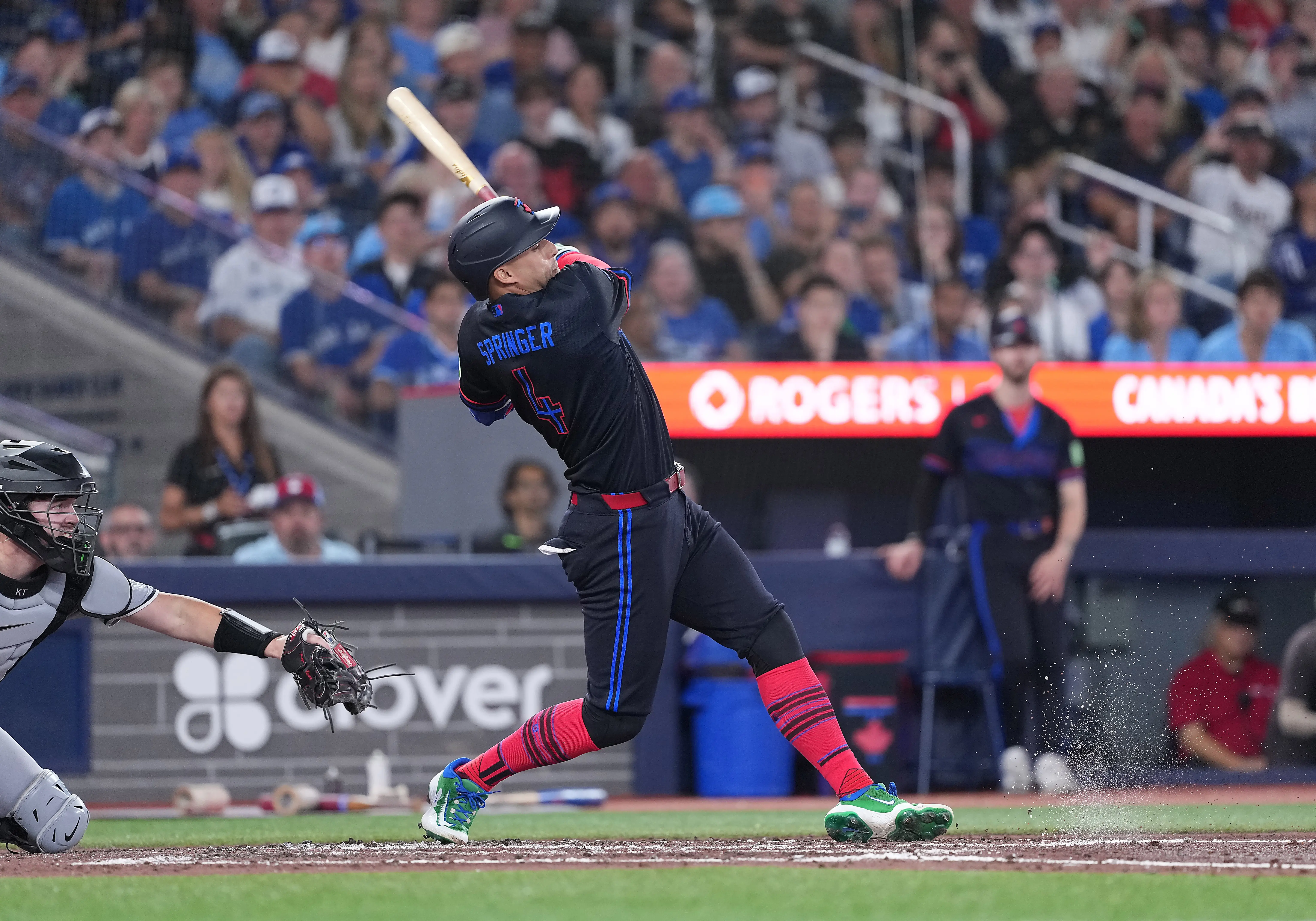 Toronto Blue Jays left fielder George Springer hits an RBI single vs the Chicago White Sox.