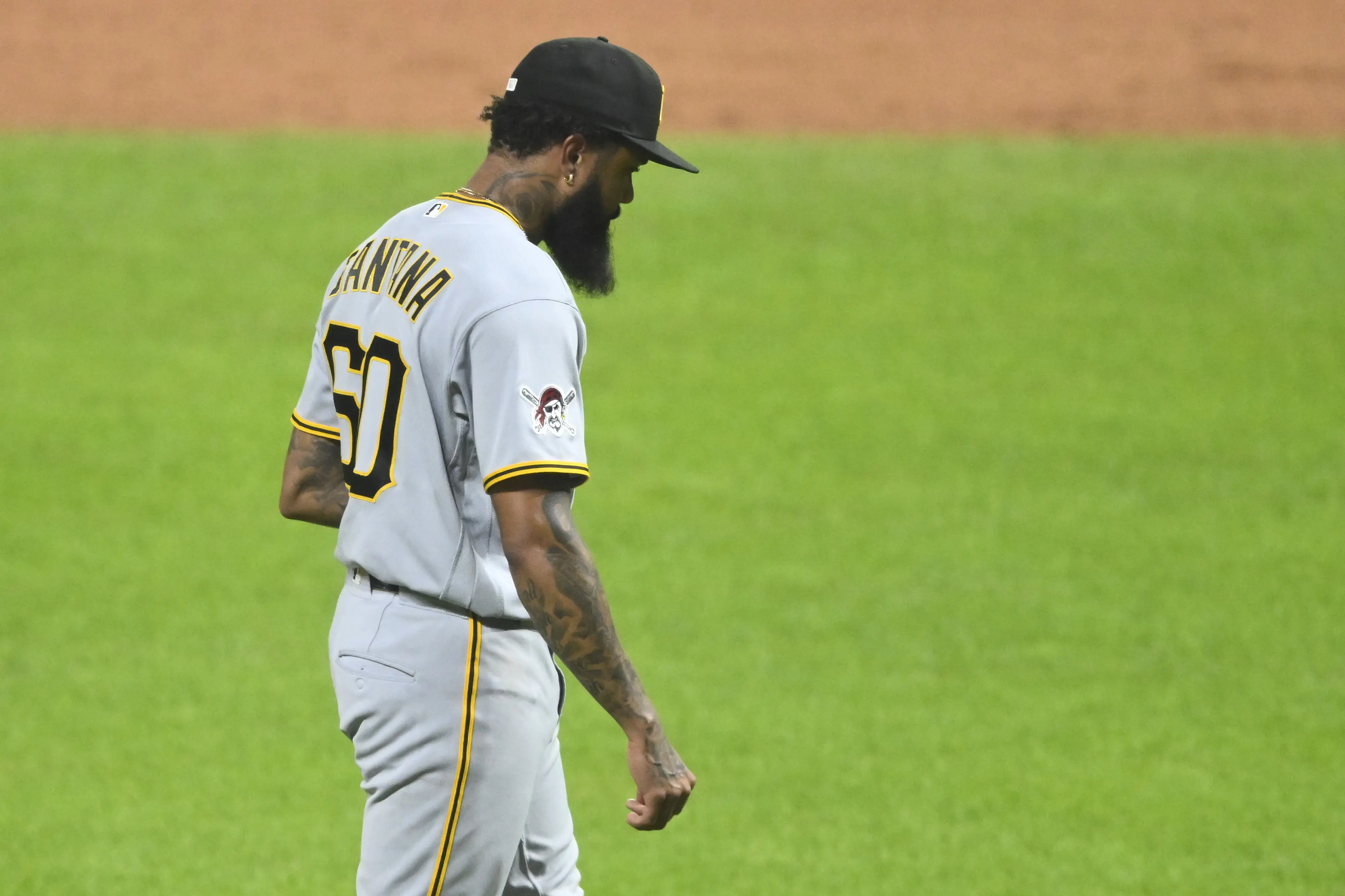 Pittsburgh Pirates reliever Dennis Santana walking off the field after allowing a game-winning home run vs the Cleveland Guardians.