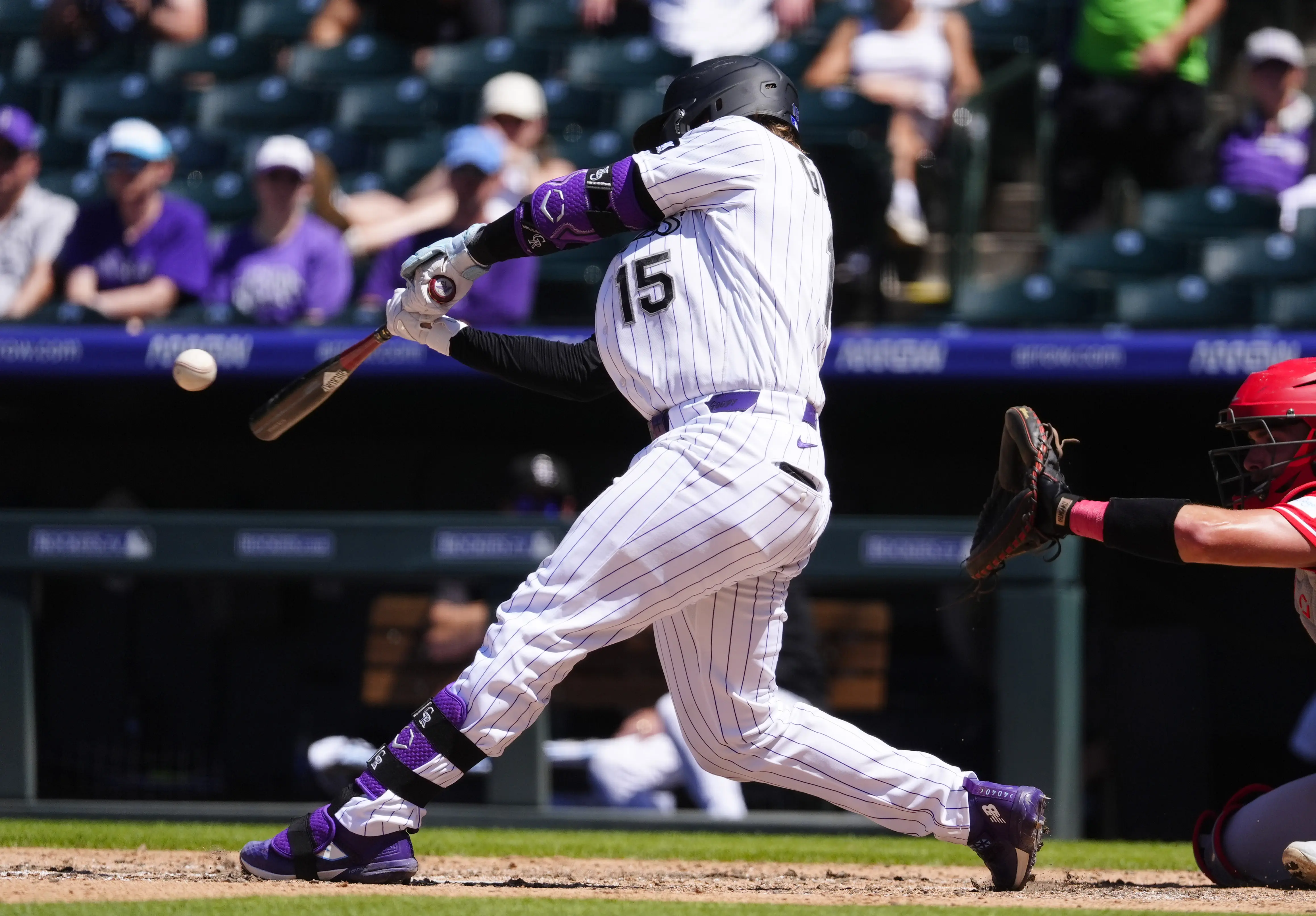 Colorado Rockies catcher Hunter Goodman swinging the bat vs the Cincinnati Reds.