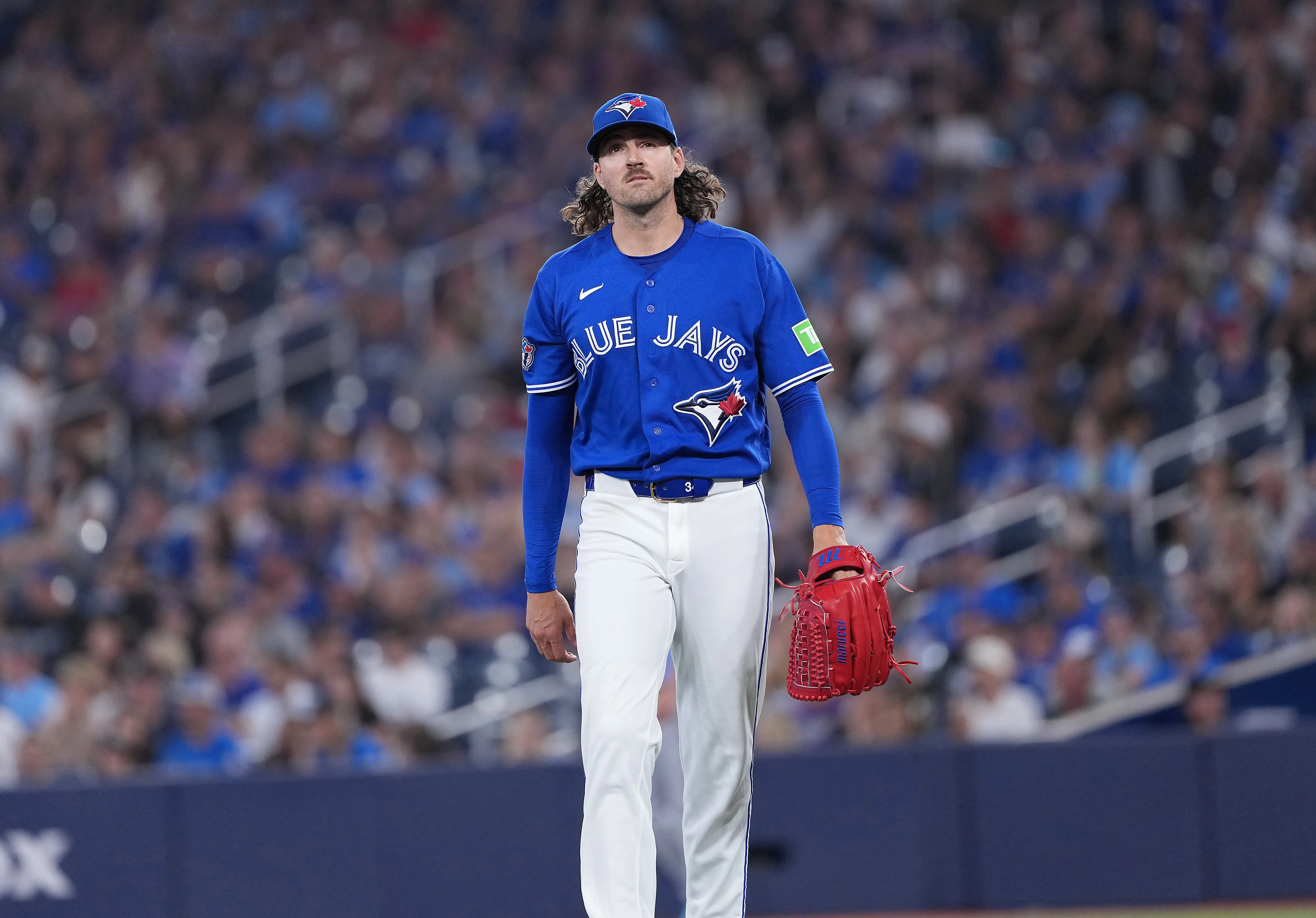 Toronto Blue Jays starting pitcher Kevin Gausman walking towards the dugout vs the Tampa Bay Rays. The Yankees could capitalize and add a quality arm to their starting rotation if the Blue Jays decide to deal Gausman at the Deadline.
