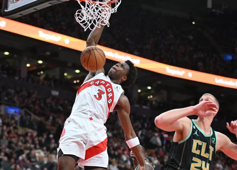 Toronto Raptors forward OG Anunoby (3) dunks over Charlotte Hornets center Mason Plumlee (24) in the second half at Scotiabank Arena. Mandatory Credit: Dan Hamilton-USA TODAY Sports