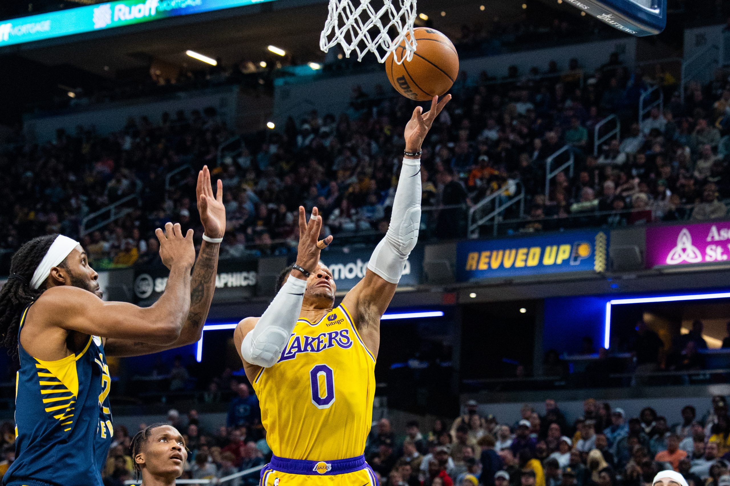 Feb 2, 2023; Indianapolis, Indiana, USA; Los Angeles Lakers guard Russell Westbrook (0) shoots while Indiana Pacers forward Isaiah Jackson (22) defends in the second half at Gainbridge Fieldhouse. Mandatory Credit: Trevor Ruszkowski-USA TODAY Sports