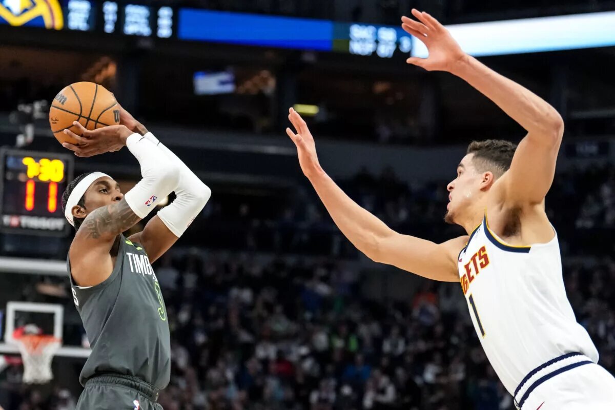 Minnesota, USA; Minnesota Timberwolves forward Jaden McDaniels (3) shoots during the third quarter against the Denver Nuggets at Target Center. Mandatory Credit: Brace Hemmelgarn-USA TODAY Sports