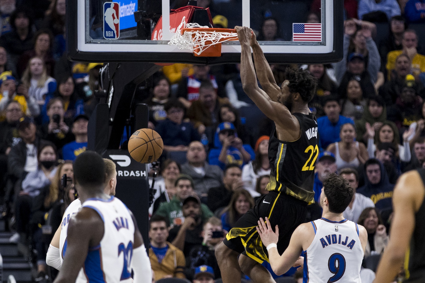 Golden State Warriors forward Andrew Wiggins (22) dunks the ball against the Washington Wizards during the second half at Chase Center. Mandatory Credit: John Hefti-USA TODAY Sports