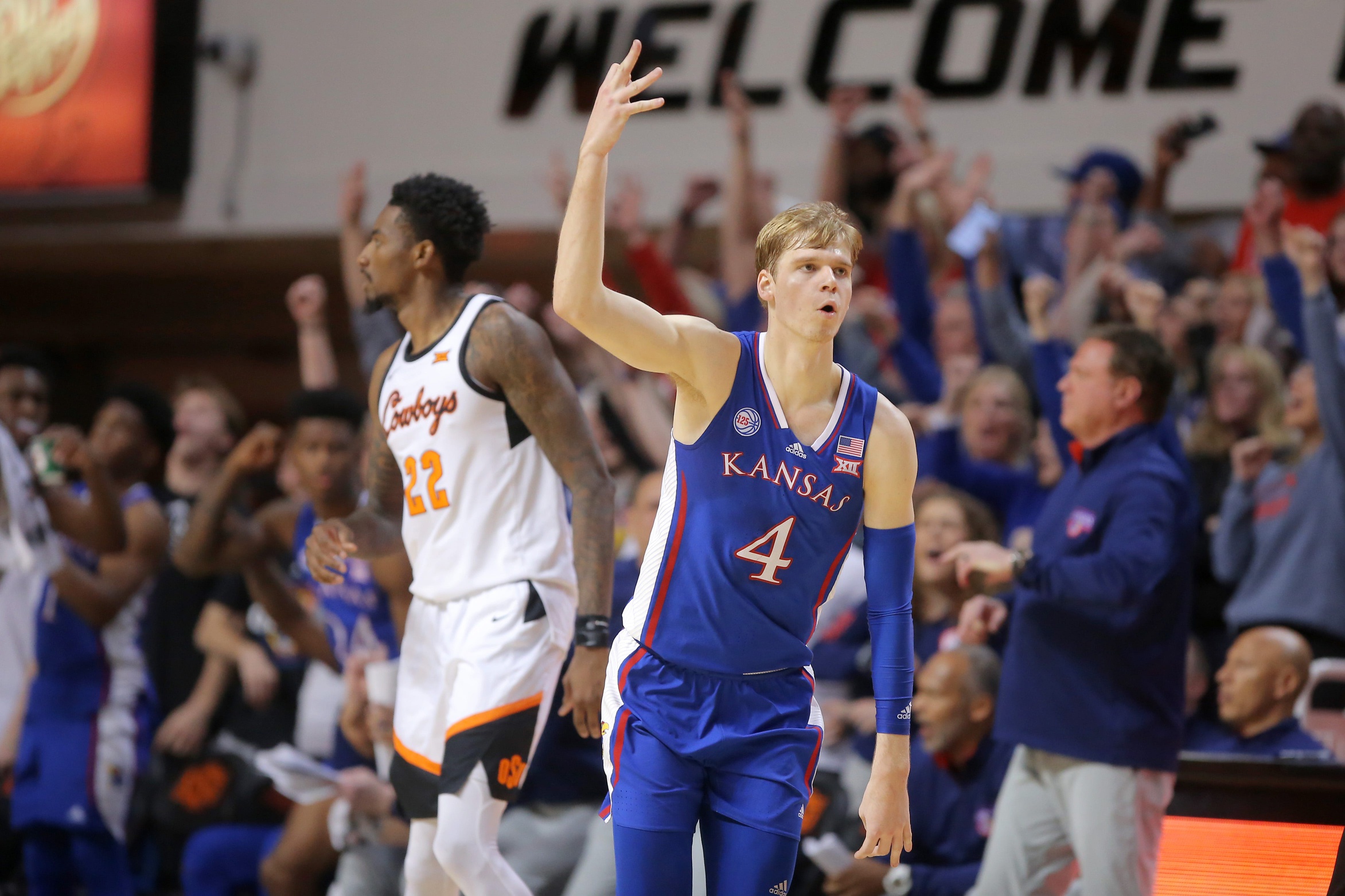 Kansas Jayhawks guard Gradey Dick (4) celebrates beside Oklahoma State Cowboys forward Kalib Boone (22) after making a 3-pointer during a men's college basketball game between the Oklahoma State University Cowboys and the Kansas Jayhawks at Gallagher-Iba Arena in Stillwater, Okla., Tuesday, Feb. 14, 2023. osuhoops -- print1