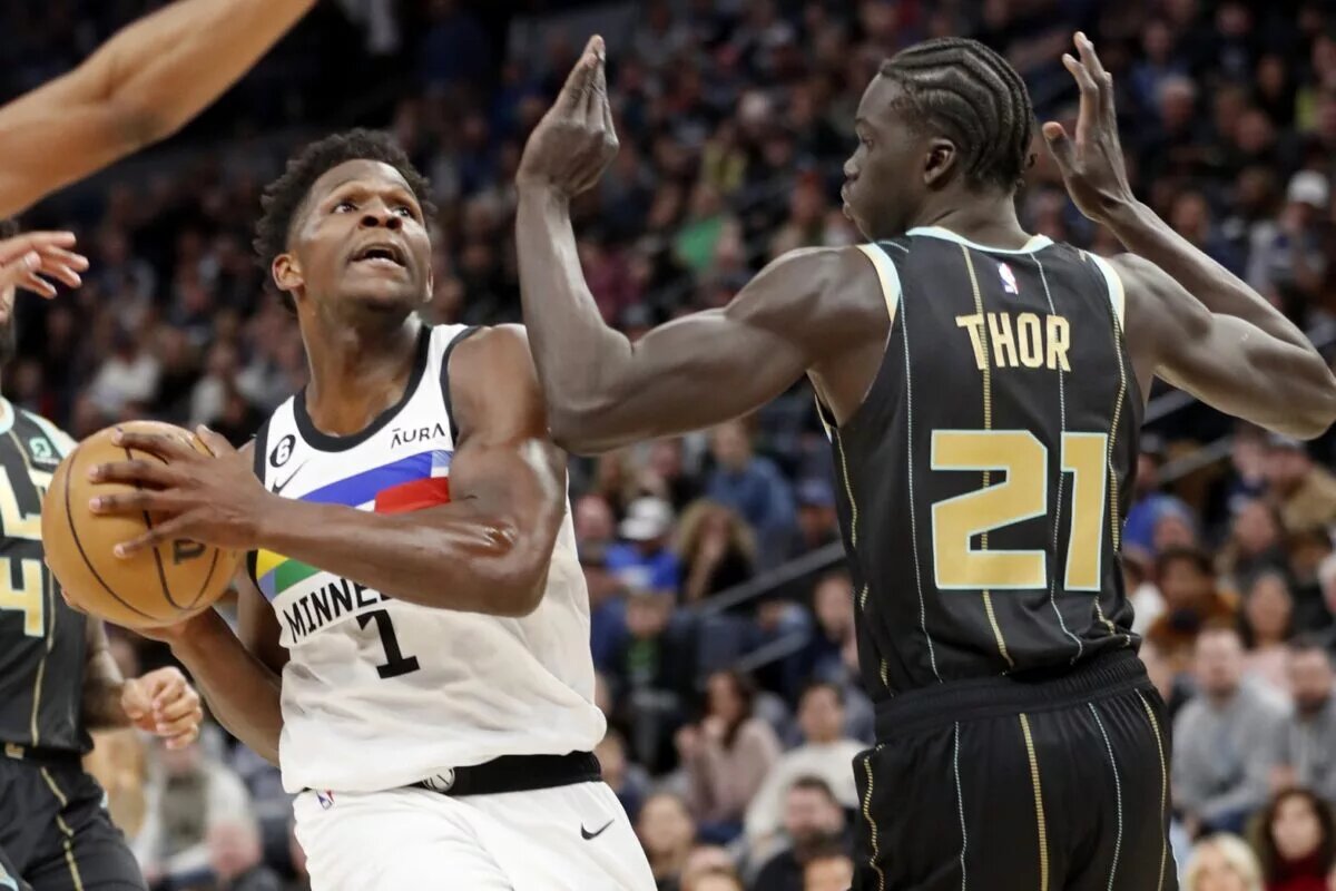 Feb 24, 2023; Minneapolis, Minnesota, USA; Minnesota Timberwolves forward Anthony Edwards (1) goes to the basket against Charlotte Hornets forward JT Thor (21) in the third quarter at Target Center. Mandatory Credit: Bruce Kluckhohn-USA TODAY Sports
