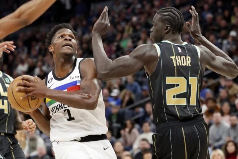 Feb 24, 2023; Minneapolis, Minnesota, USA; Minnesota Timberwolves forward Anthony Edwards (1) goes to the basket against Charlotte Hornets forward JT Thor (21) in the third quarter at Target Center. Mandatory Credit: Bruce Kluckhohn-USA TODAY Sports