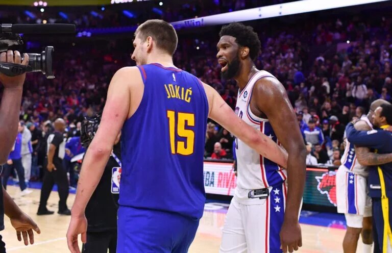 Jan 28, 2023; Philadelphia, Pennsylvania, USA; Denver Nuggets center Nikola Jokic (15) and Philadelphia 76ers center Joel Embiid (21) meet after a game at Wells Fargo Center. Mandatory Credit: Kyle Ross-USA TODAY Sports
