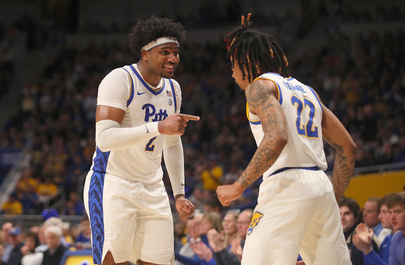 Pittsburgh Panthers Nike Sibande (22) celebrates with Blake Hinson (2) after making a three point shot during the second half against the Syracuse Orange on February 25, 2023 at the Petersen Events Center in Pittsburgh, PA. Pittsburgh Panthers Vs Syracuse Orange Mens Basketball