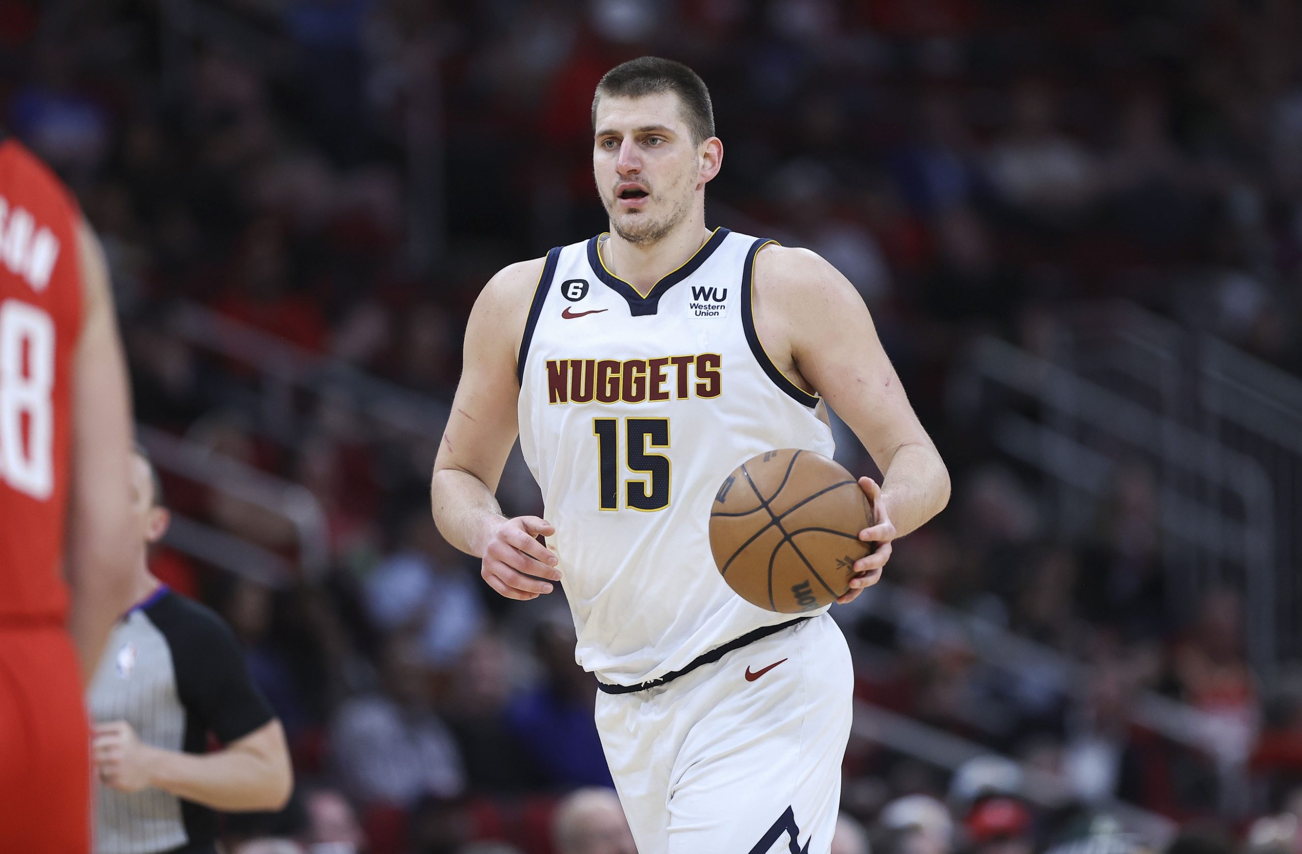 Feb 28, 2023; Houston, Texas, USA; Denver Nuggets center Nikola Jokic (15) brings the ball up the court during the third quarter against the Houston Rockets at Toyota Center. Mandatory Credit: Troy Taormina-USA TODAY Sports