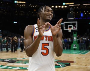 Mar 5, 2023; Boston, Massachusetts, USA; New York Knicks guard Immanuel Quickley (5) smiles as he leaves the court after their double overtime win over the Boston Celtics at TD Garden. Mandatory Credit: Winslow Townson-USA TODAY Sports