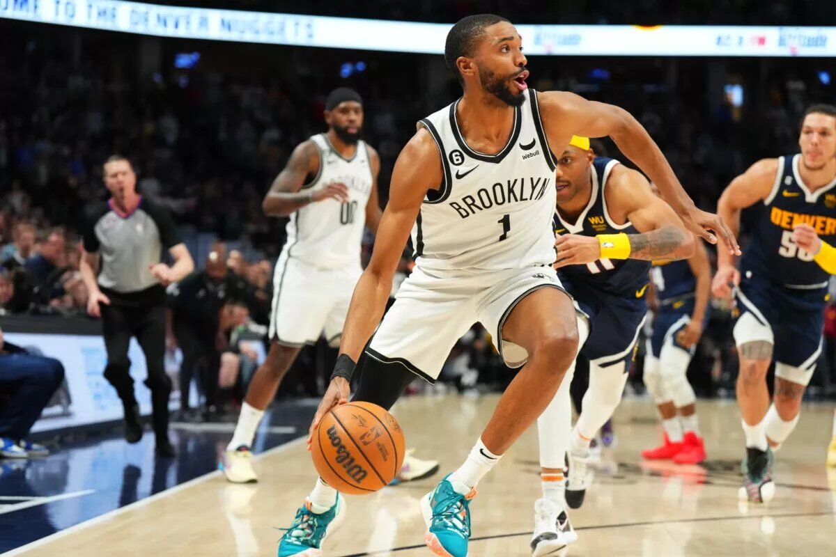 Mar 12, 2023; Denver, Colorado, USA; Brooklyn Nets forward Mikal Bridges (1) drives to the net in the fourth quarter against the Denver Nuggets at Ball Arena. Mandatory Credit: Ron Chenoy-USA TODAY Sports