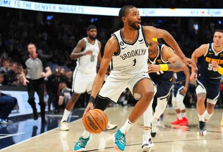 Mar 12, 2023; Denver, Colorado, USA; Brooklyn Nets forward Mikal Bridges (1) drives to the net in the fourth quarter against the Denver Nuggets at Ball Arena. Mandatory Credit: Ron Chenoy-USA TODAY Sports
