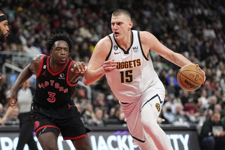 Mar 14, 2023; Toronto, Ontario, CAN; Denver Nuggets center Nikola Jokic (15) drives to the net against Toronto Raptors forward O.G. Anunoby (3) during the second half at Scotiabank Arena. Mandatory Credit: John E. Sokolowski-USA TODAY Sports
