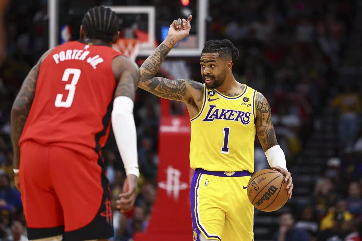 Mar 15, 2023; Houston, Texas, USA; Los Angeles Lakers guard D'Angelo Russell (1) brings the ball up the court as Houston Rockets guard Kevin Porter Jr. (3) defends during the third quarter at Toyota Center. Mandatory Credit: Troy Taormina-USA TODAY Sports