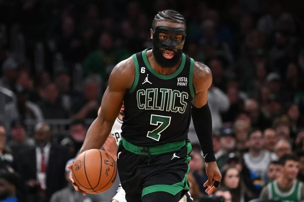 Mar 26, 2023; Boston, Massachusetts, USA; Boston Celtics guard Jaylen Brown (7) dribbles the ball against the San Antonio Spurs during the third quarter at the TD Garden. Mandatory Credit: Brian Fluharty-USA TODAY Sports
