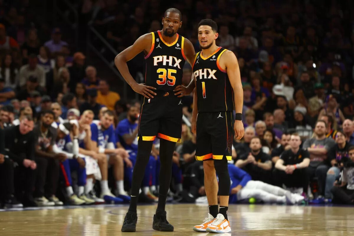 Apr 18, 2023; Phoenix, Arizona, USA; Phoenix Suns guard Devin Booker (1) with forward Kevin Durant (35) against the Los Angeles Clippers in the second half during game two of the 2023 NBA playoffs at Footprint Center. Mandatory Credit: Mark J. Rebilas-USA TODAY Sports